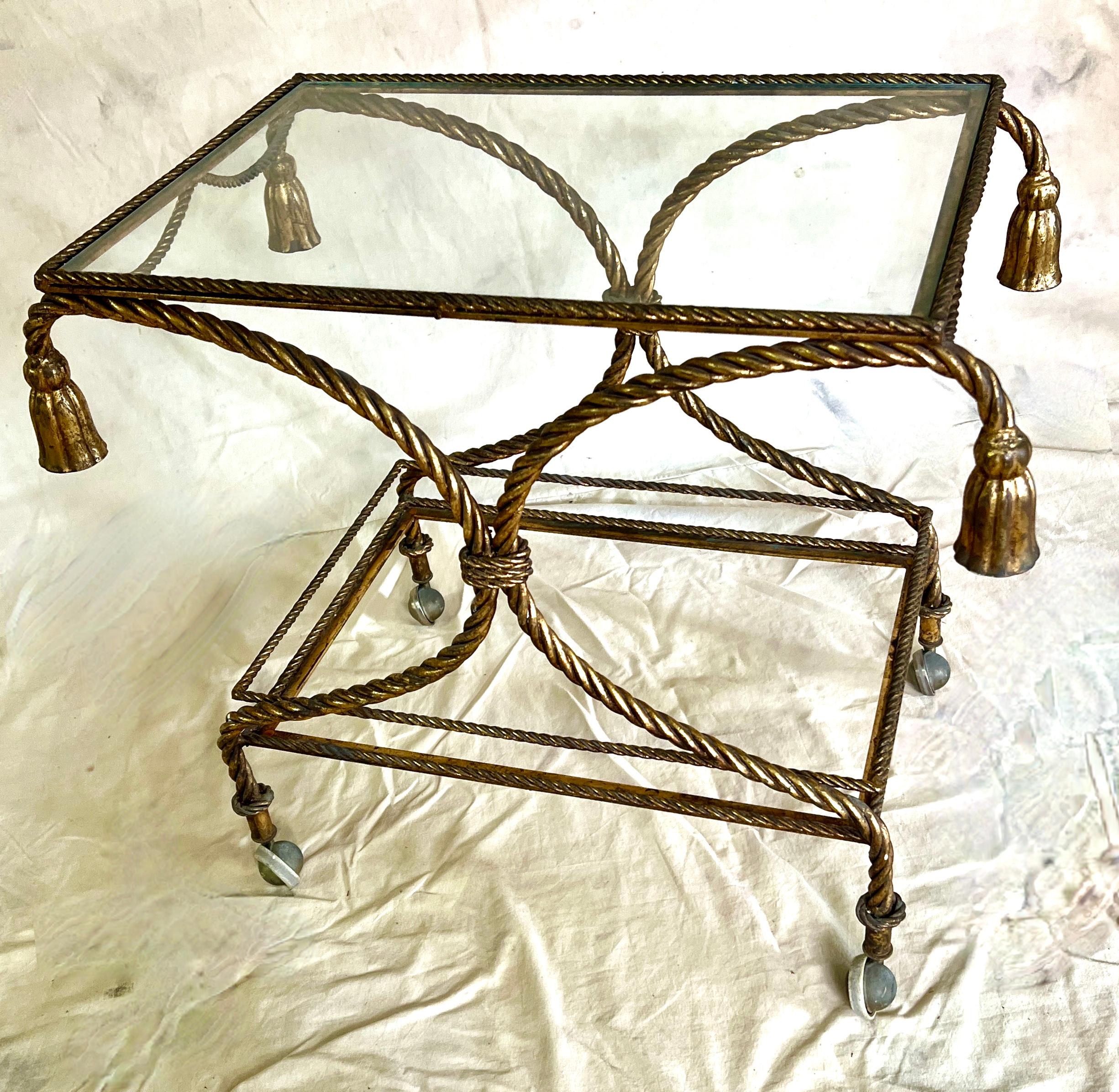 Two Tier Bar Cart made of gilt metal twisted rope.  The cart can easily be wheeled from one room to another, from the bar to the cocktail table.

A great Hollywood Regency look and a compliment to many spaces.  The glass can be replaced with mirror
