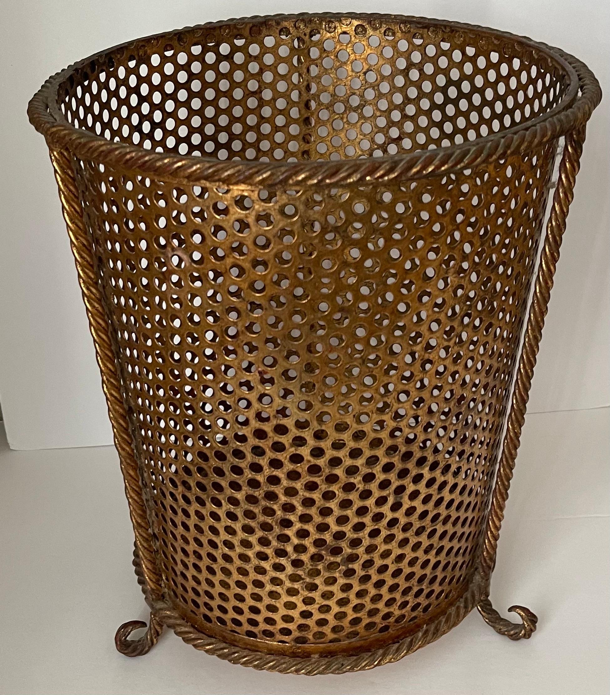 Italian gilt metal  umbrella stand. Rope trim and trio of curved rope feet. Signed Made in Italy in the underside. 