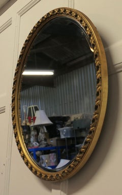 Italian Gilt Oval Mirror This Mirror Has a Deeply Moulded Oval Frame