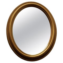 Italian Gilt Oval Mirror This Mirror Has a Deeply Moulded Oval Frame