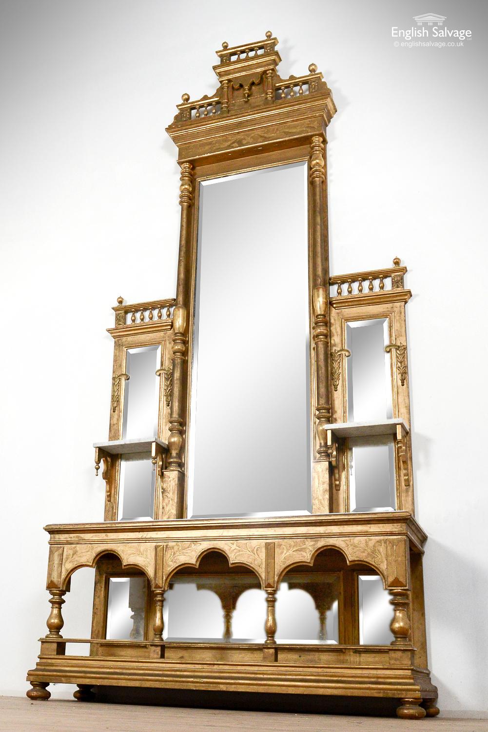 Impressive, antique mirrored sacristy dresser stand from late 1800s. Richly ornamented with marble shelves, decorative pilasters and finials, and foliate mouldings, it is a rare and high quality piece. Six beveled mirrors make up the back of the