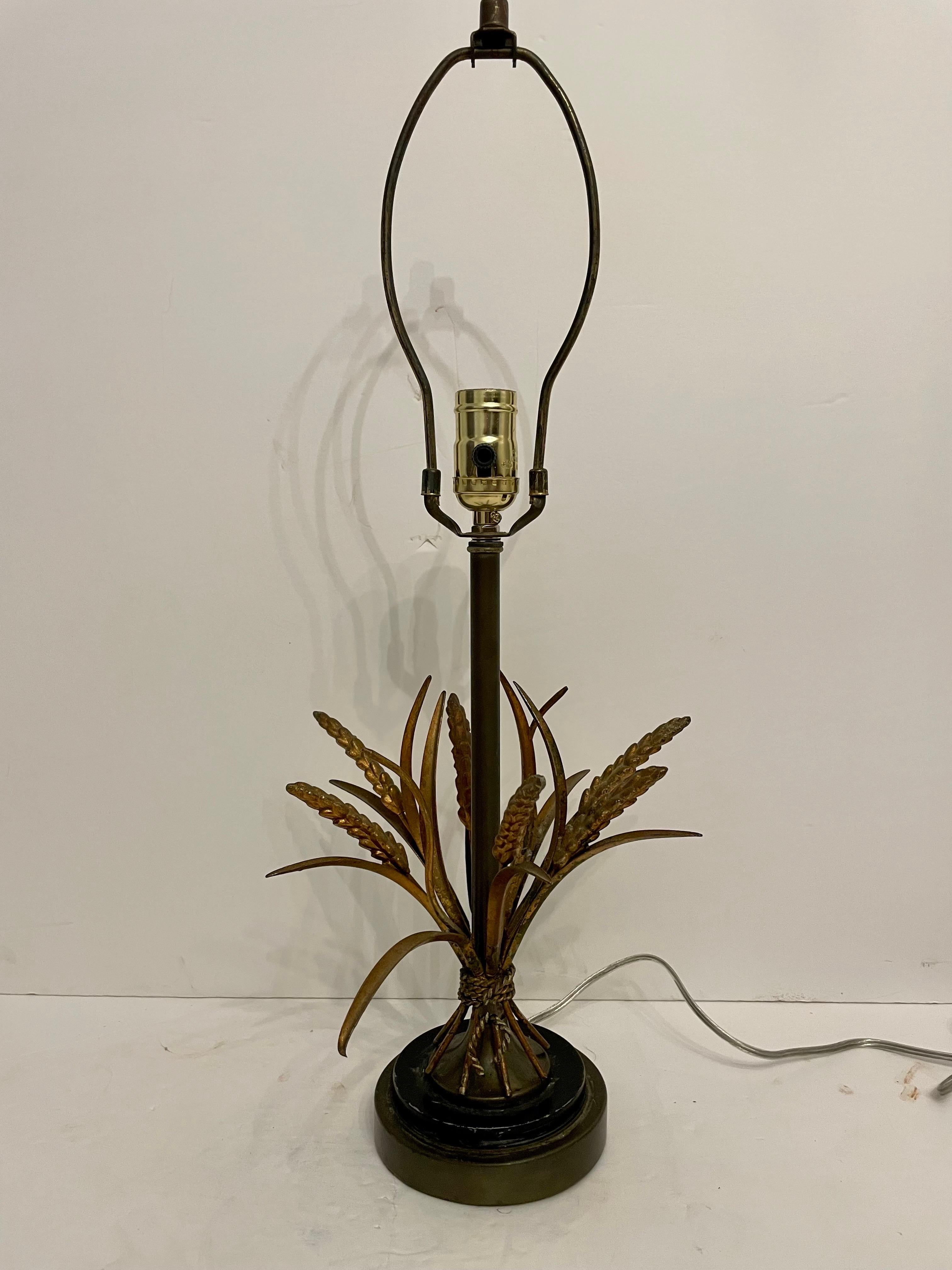 Italian gilt sheaf of wheat lamp rewired with old gold leaf finish. Nice scale and detail. Italy tag on twisted rope holding wheat sheaf. Some paint loss around base due to age and use. Good overall condition. Measures 23
