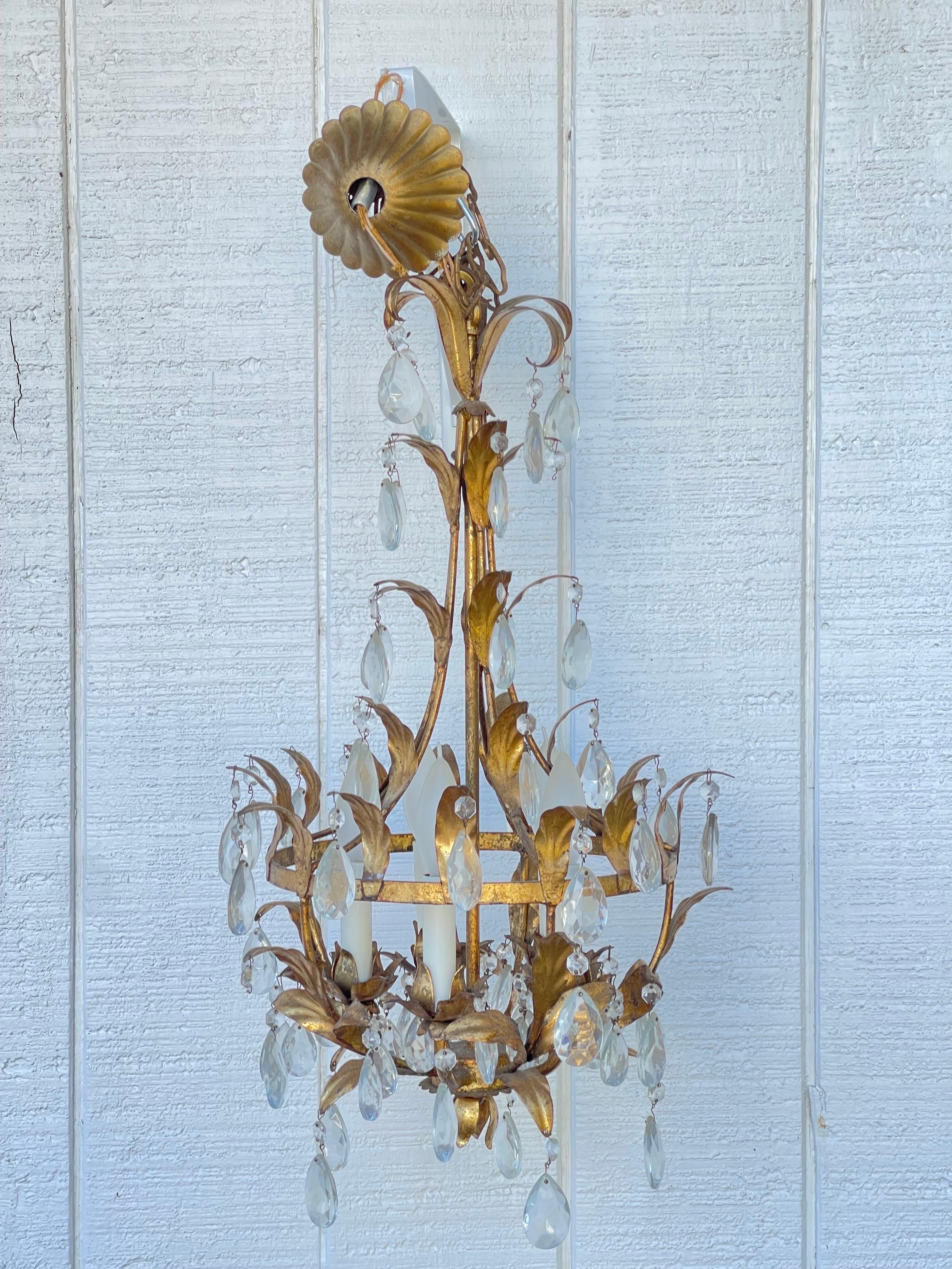 Italian Gilt Tole Chandelier. Highly glamorous this six light chandelier would be perfect in a powder room or entryway.  Stamped with a metal tag 