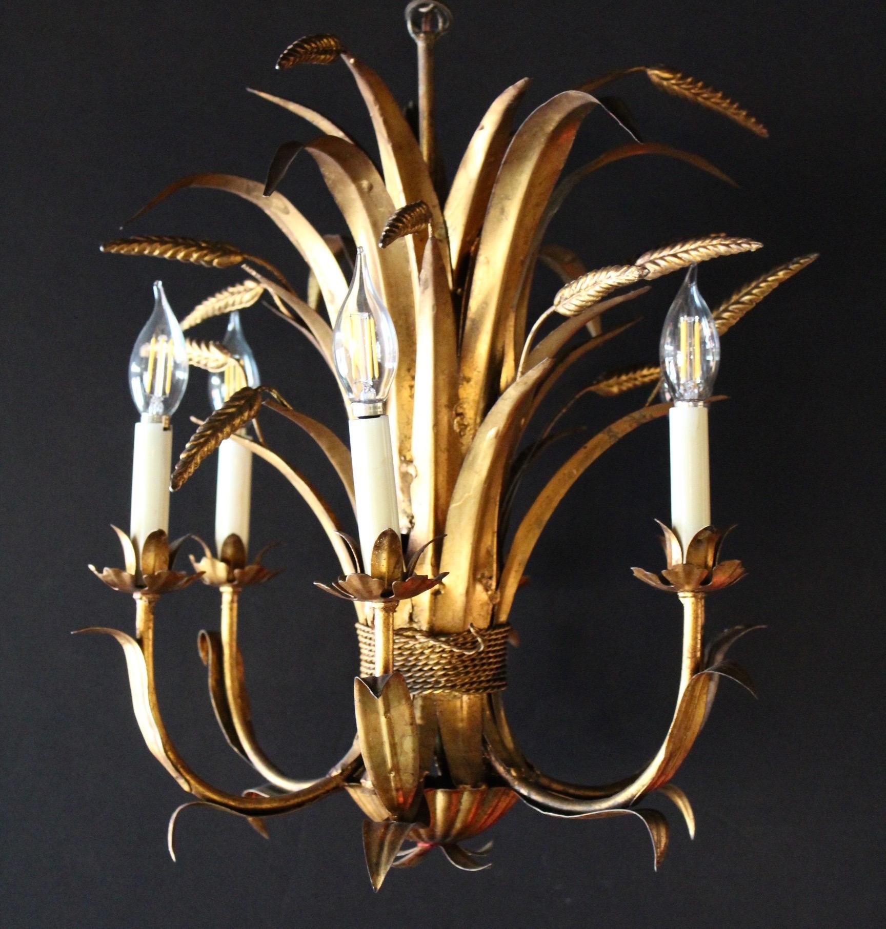 Italian gilt tole chandelier representing a Bouquet of wheat. Lovely and we also have a matching pair of sconce if interested. Six lights.