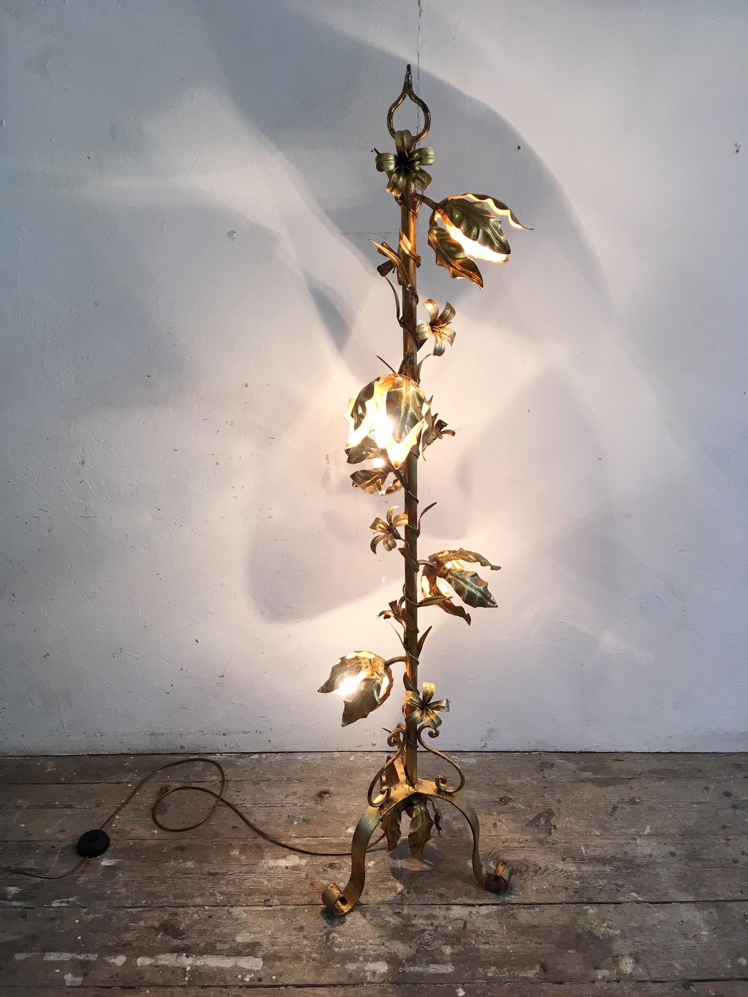 Vintage Italian gilt tole floor lamp, large flower buds, lily flowers and leaves twist around the central post. Five lamp holders, one per bud. The lamp is in very good condition, the gilt is strong and bright in colour and finish. There is a foot
