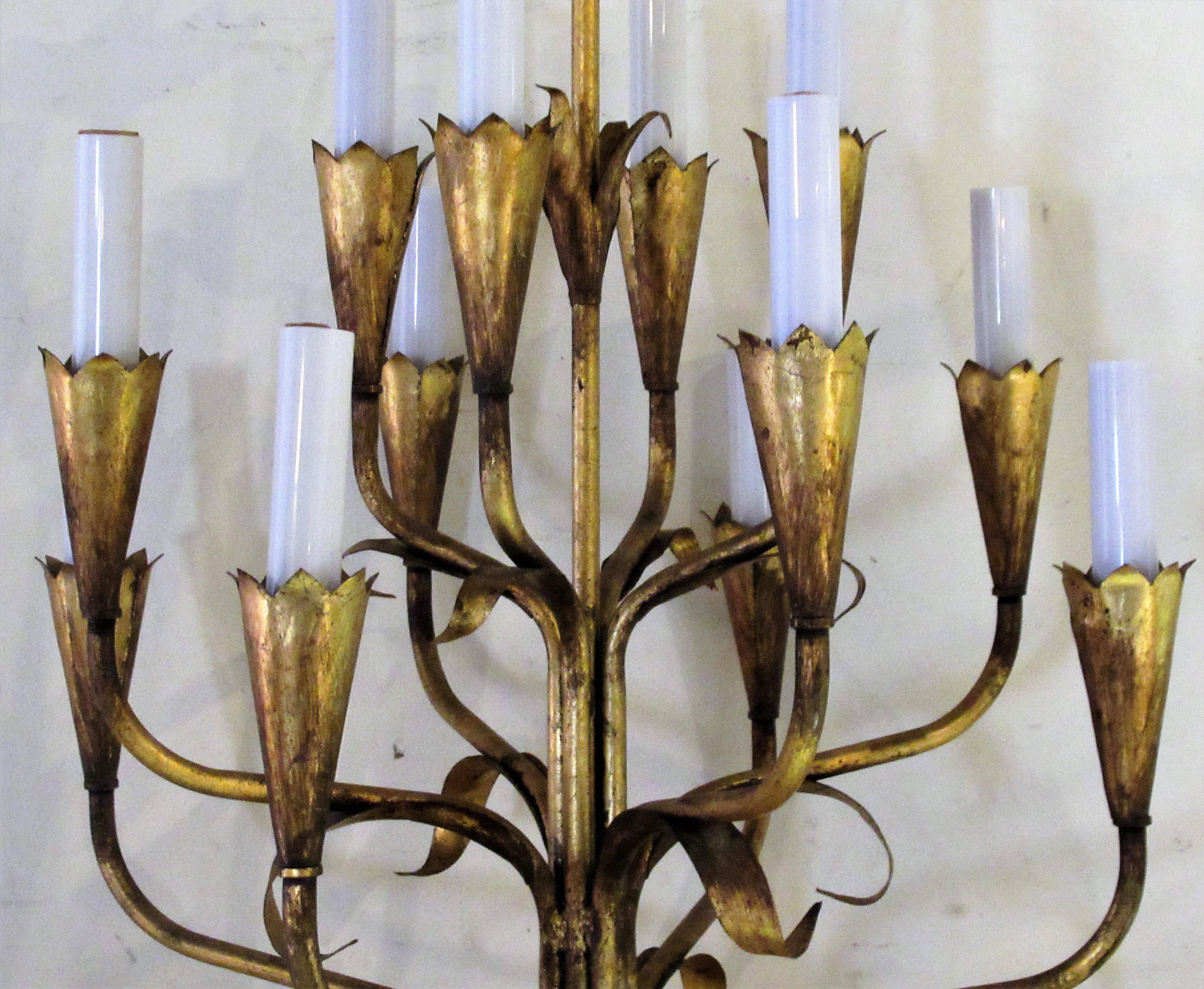  Gilt tole metal leaf form twelve armature candle chandelier with beautiful aged original gilded surface in overall great vintage condition. Old paper label  - Made in Spain - circa 1960.