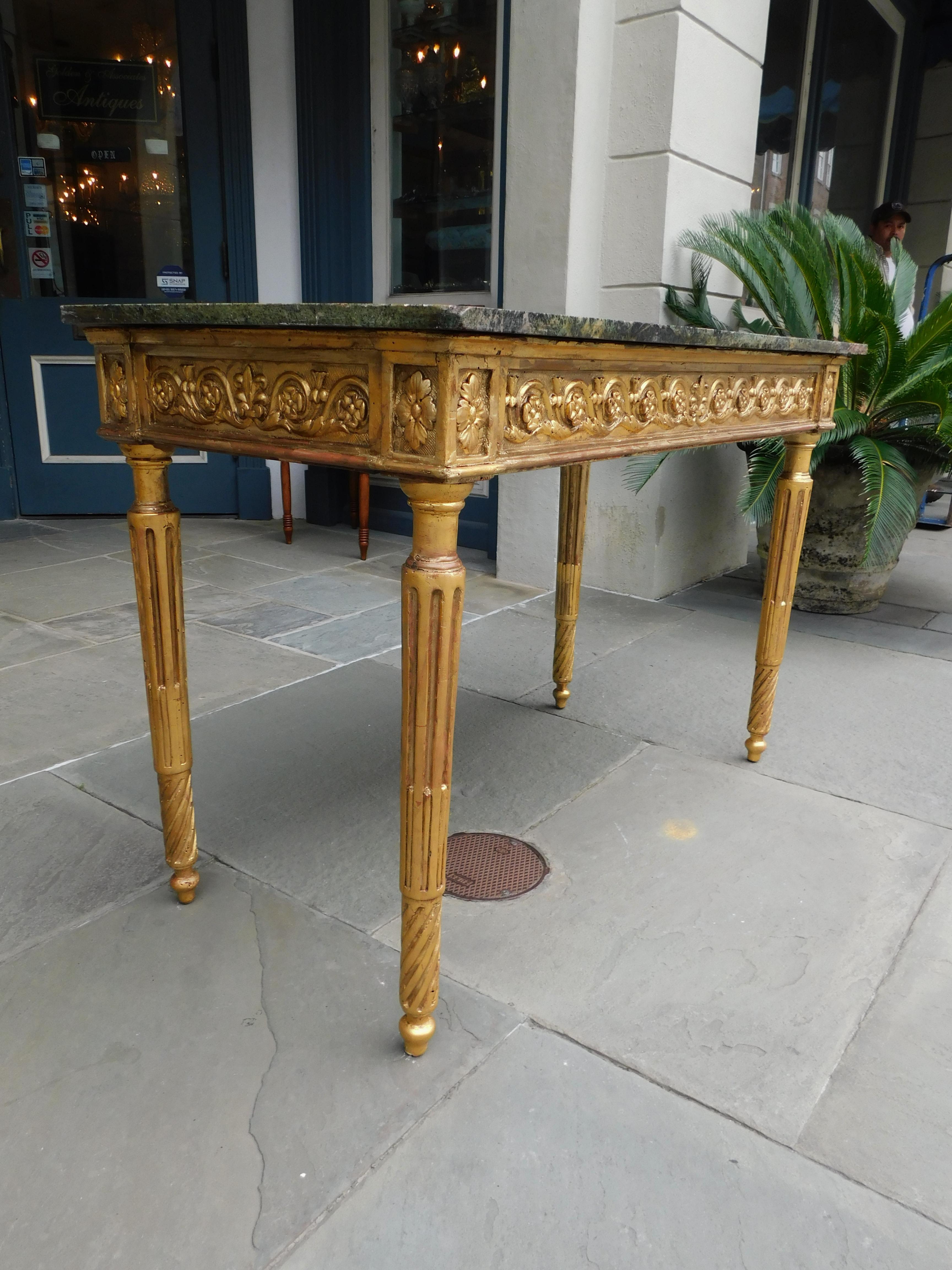 Late 18th Century Italian Gilt Wood Marble Top Foliage Console Table with Fluted Legs, Circa 1770 For Sale