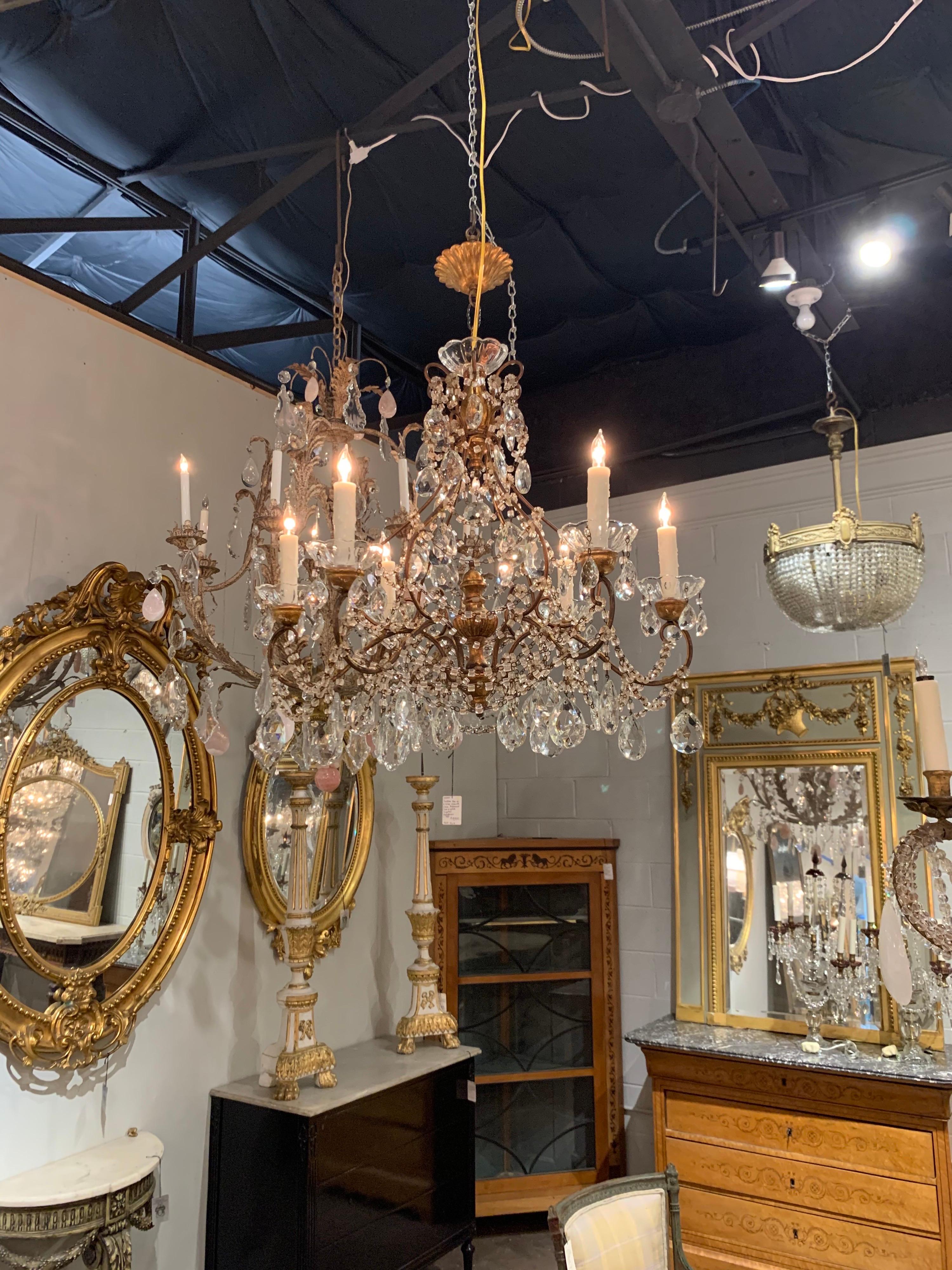 Early 20th century Italian giltwood and beaded crystal chandelier with 6 lights. Featuring a large array of beads and crystals. Great scale and shape on this piece. Exquisite!
 