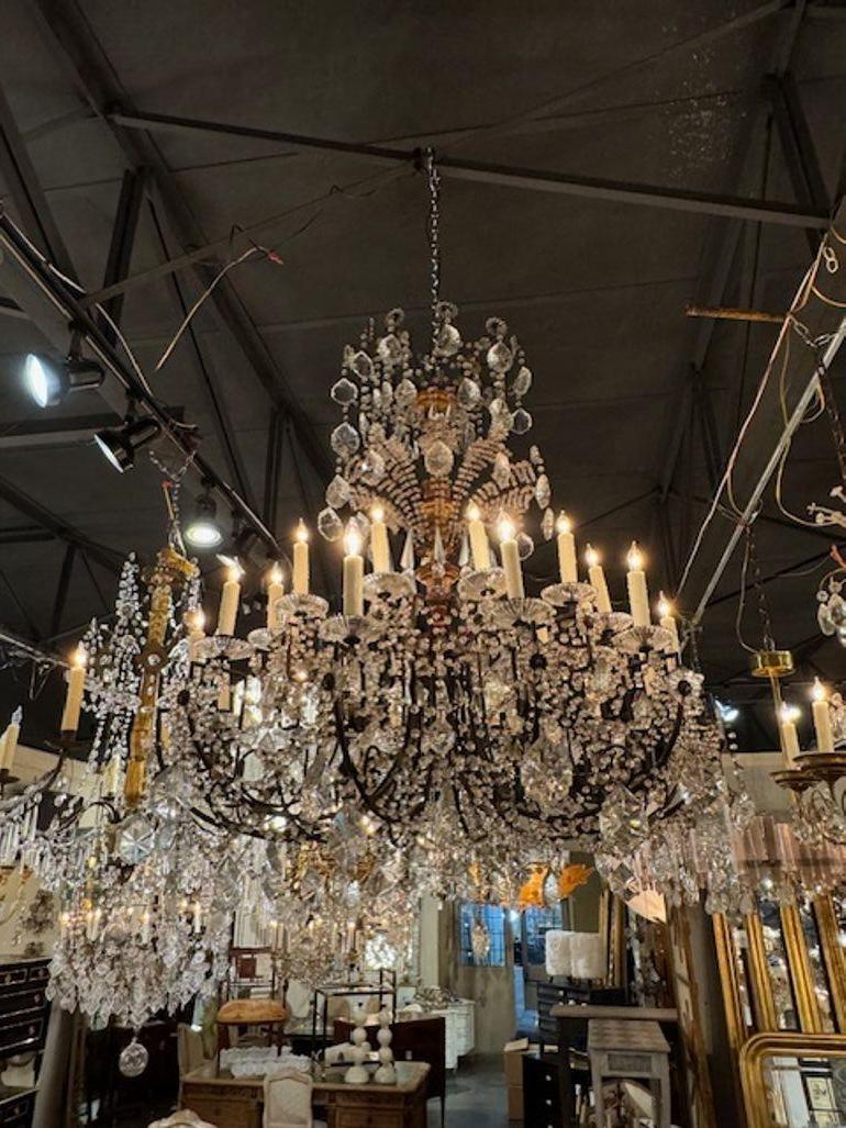 Large scale 19th century Italian giltwood and crystal chandelier. Circa 1880. This chandelier is sure to make a statement! We have two available, priced each. 52
