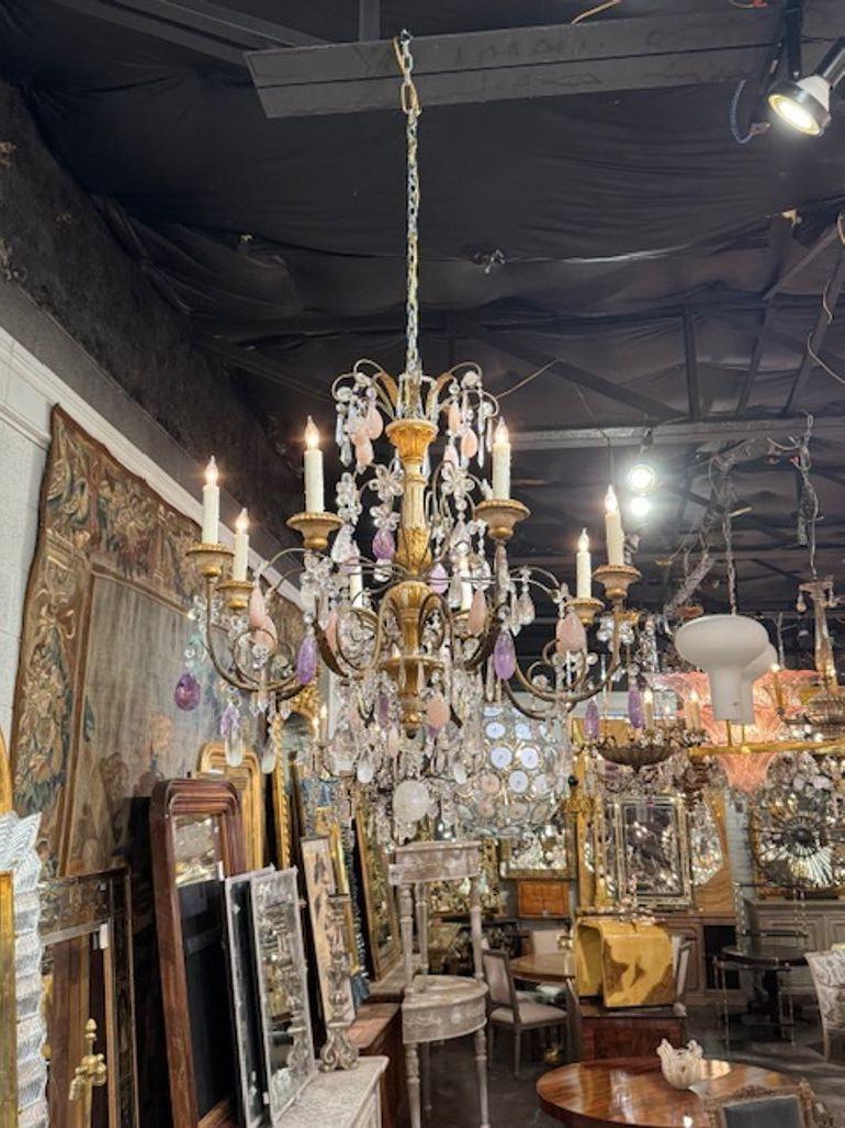 Beautiful Italian parcel giltwood and iron chandelier with rose quartz, amethyst, and rock crystal. Circa 1890. The chandelier has been professionally rewired, comes with matching chain and canopy. It is ready to hang! 34 x 34