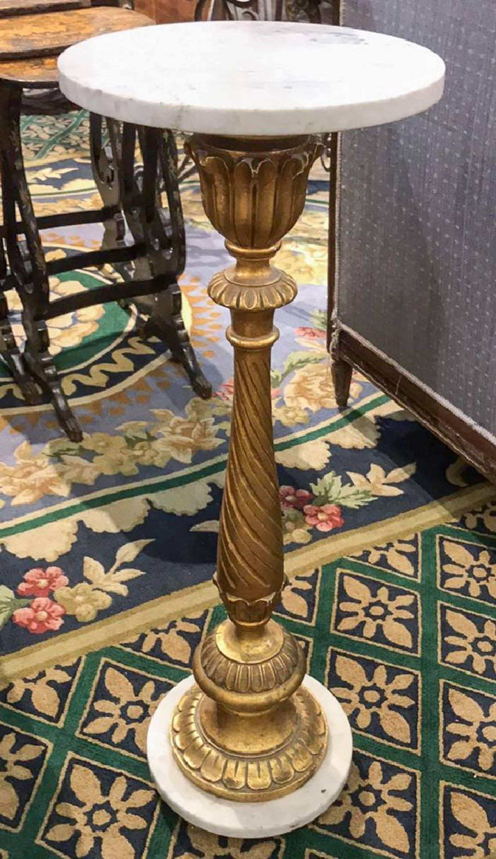 Wonderfully carved antique Italian carved giltwood twist designed display pedestal with white Carrara marble circular top and base.