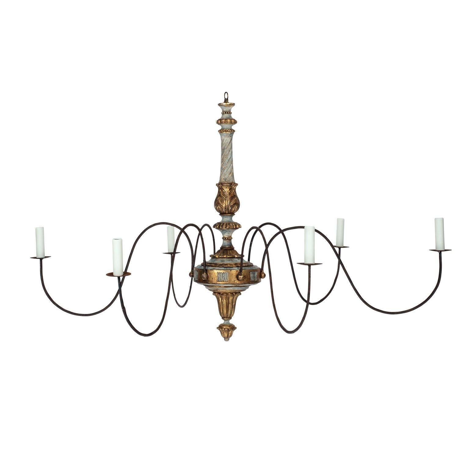 Italian giltwood and painted six-arm chandelier: chandelier hand-carved and painted in gray-blue with gilt accents circa 1885-1904. Restored with six new iron arms. Newly-wired for use within the USA. Candelabra-sized sockets. Includes four feet of