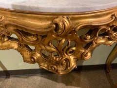 Italian Giltwood and White Marble-Top Console Table with Scrolls /Floral Motif