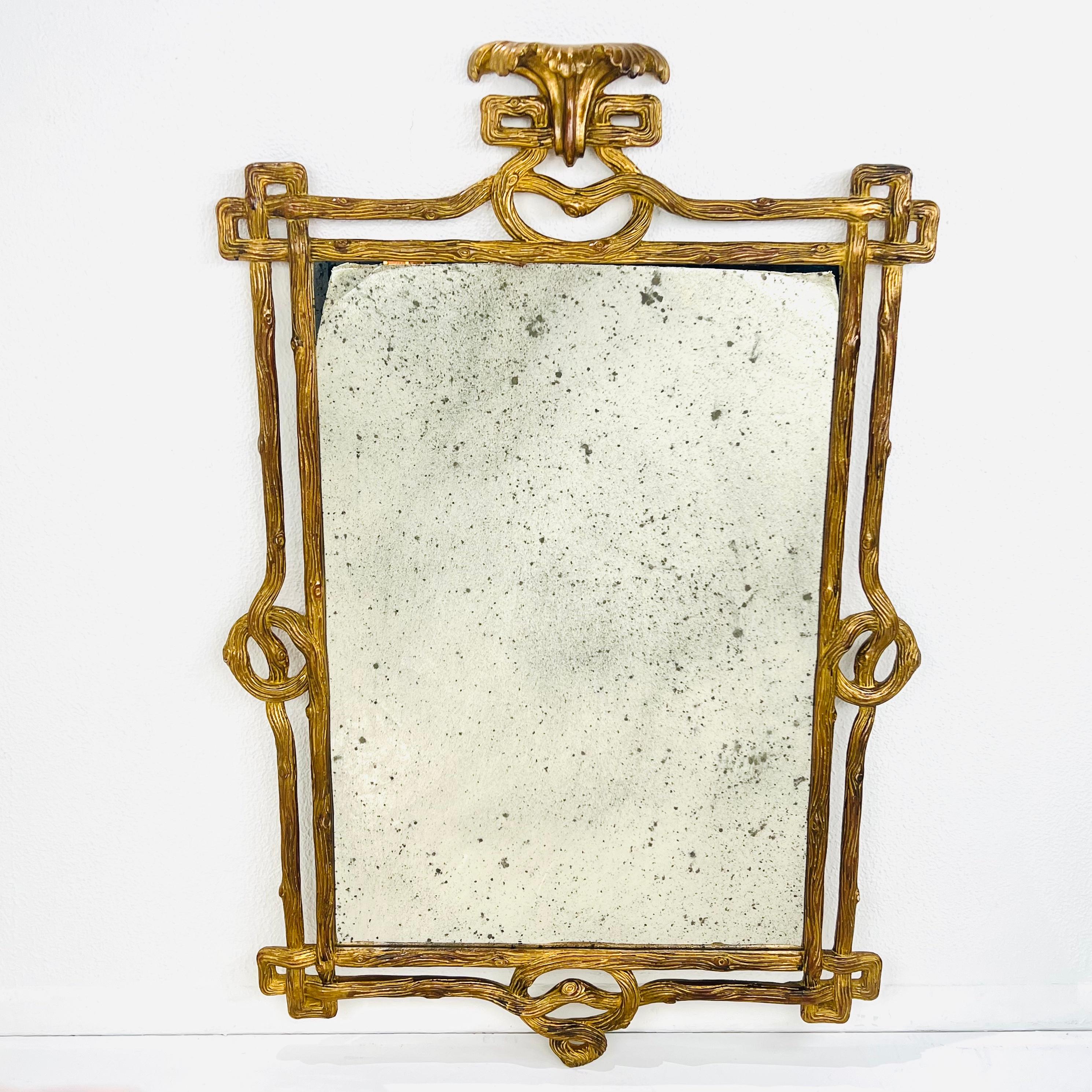 Carved wood branch frame featuring antique mirror and gold leaf finish. Created in Italy. Good condition with minimal wear from age and use. 