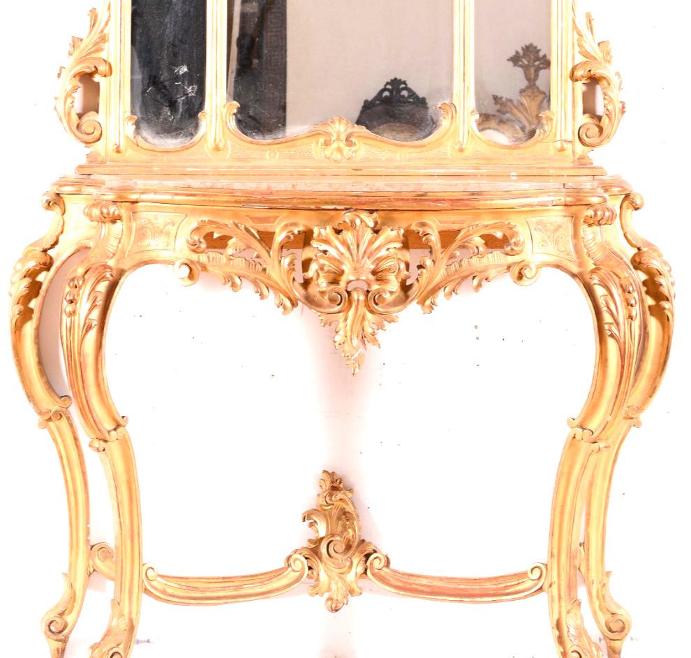 A fabulous Italian giltwood console table and mirror.
Beautifully carved with very nice original gold leaf, the console with inset marble. 
Highly decorative, with carved foliage throughout.
(Marble can be changed to the customers