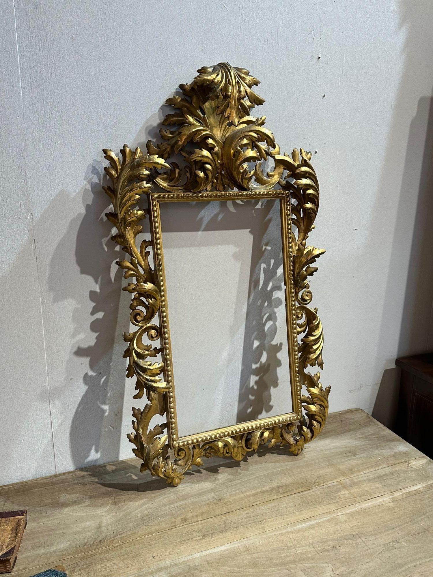 Early 19th century Italian carved and giltwood narrow Florentine frame. Circa 1840. A fine addition to any home!