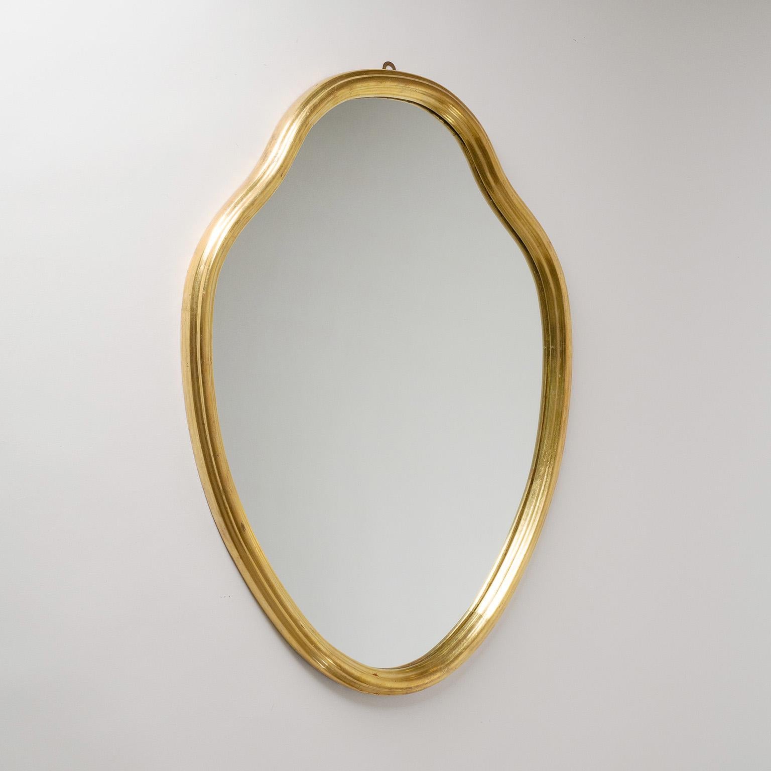 Fine Italian giltwood mirror from the 1940s. Very nicely profiled carved wood frame with leaf gold and new backplate.