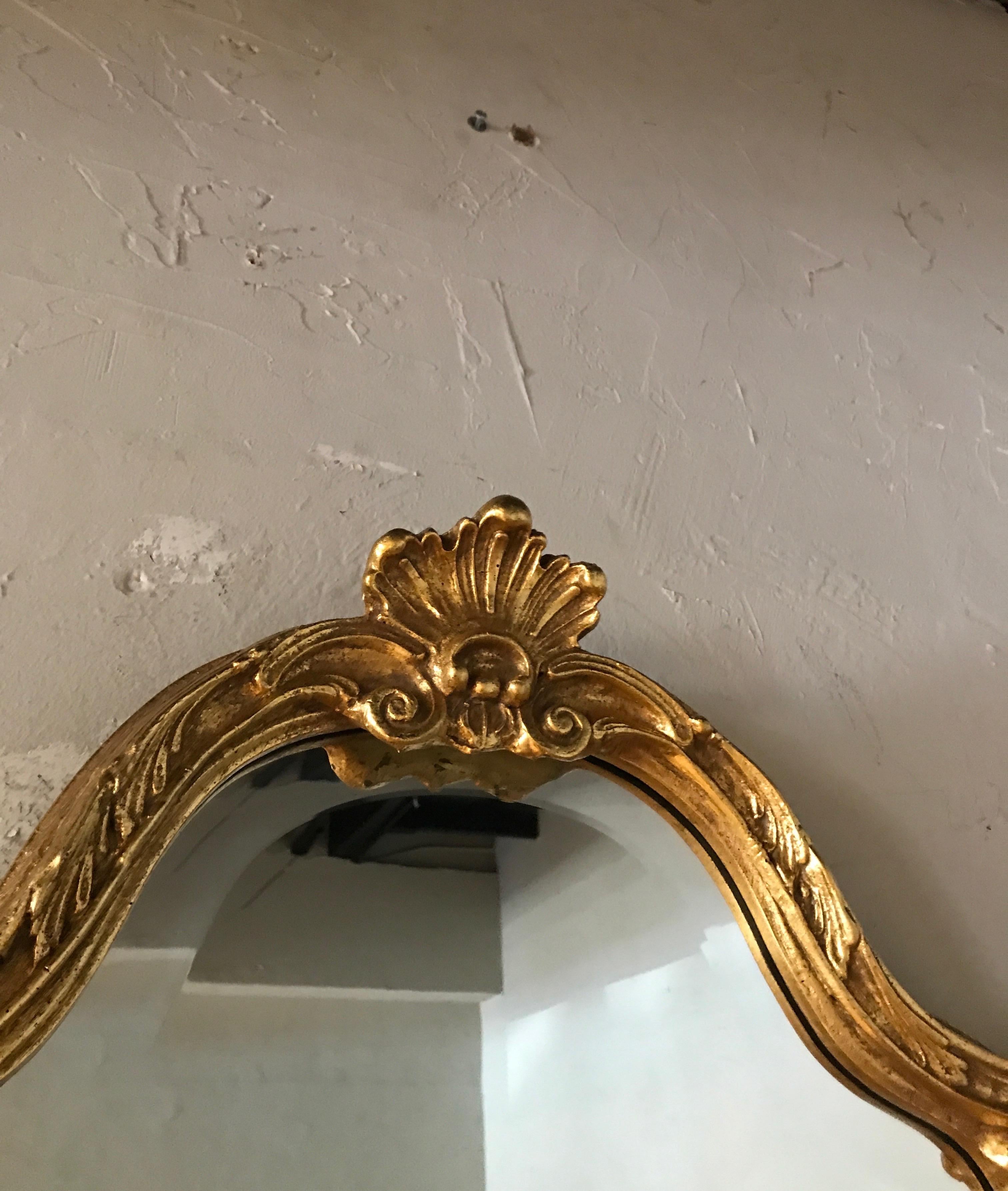 French style giltwood carved mirror by the Friedman Brothers.