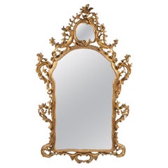 Italian Giltwood Mirror with Floral and Urn Carving Italian Giltwood Mirror with Floral and Urn Carving