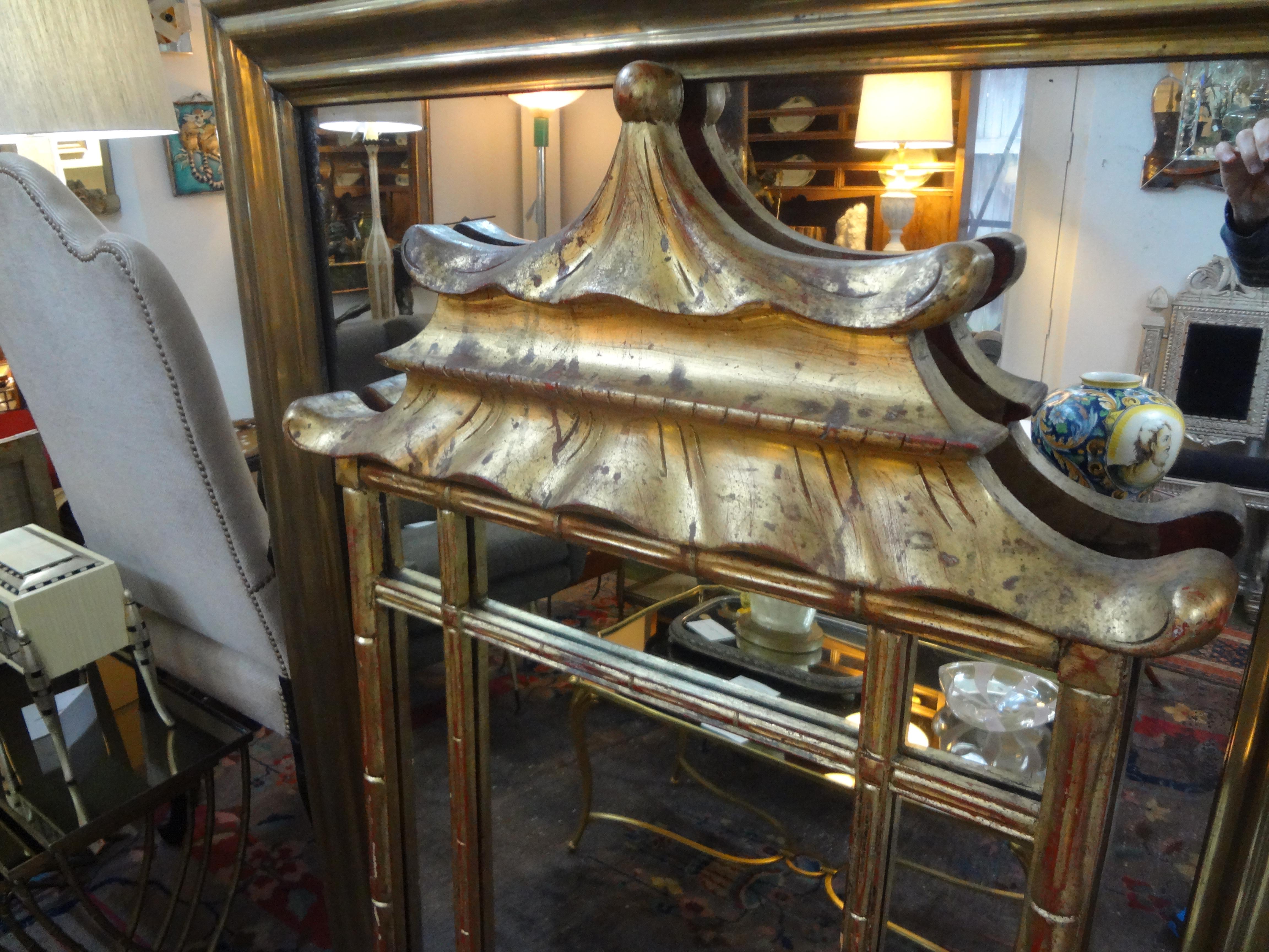 Stunning Italian Chinese Chippendale style giltwood pagoda mirror. This beautifully shaped vintage Italian chinoiserie gilt wood mirror has an interesting divided mirror perimeter with a pagoda top. Great patina!