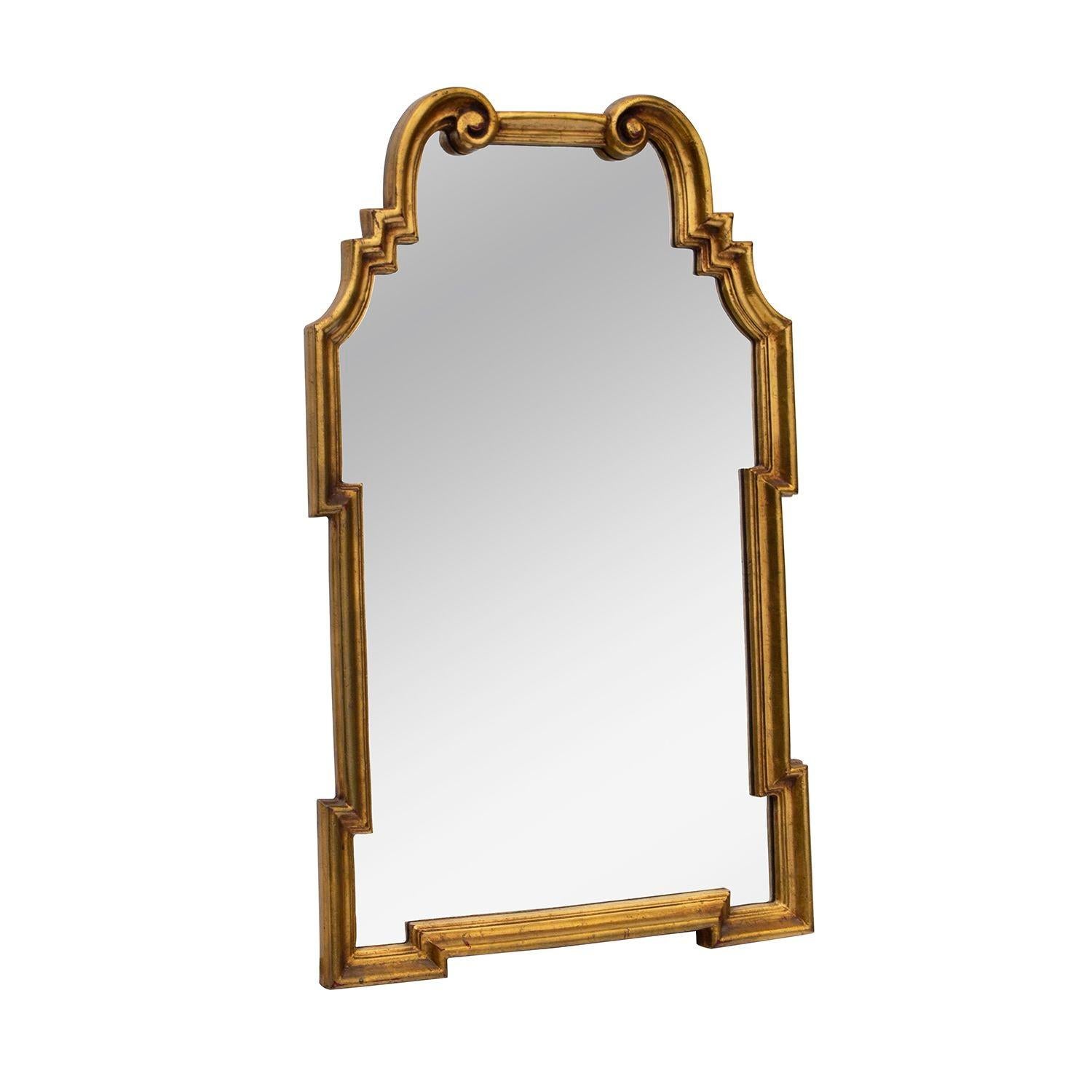 Italy, 1970s.
Hollywood Regency vertical gilded mirror made in Italy for La Barge. This classic mirror has an arched frame with scrolled pediment and contrasting geometric-form sides. Would look great in a powder room, especially over wallpaper.