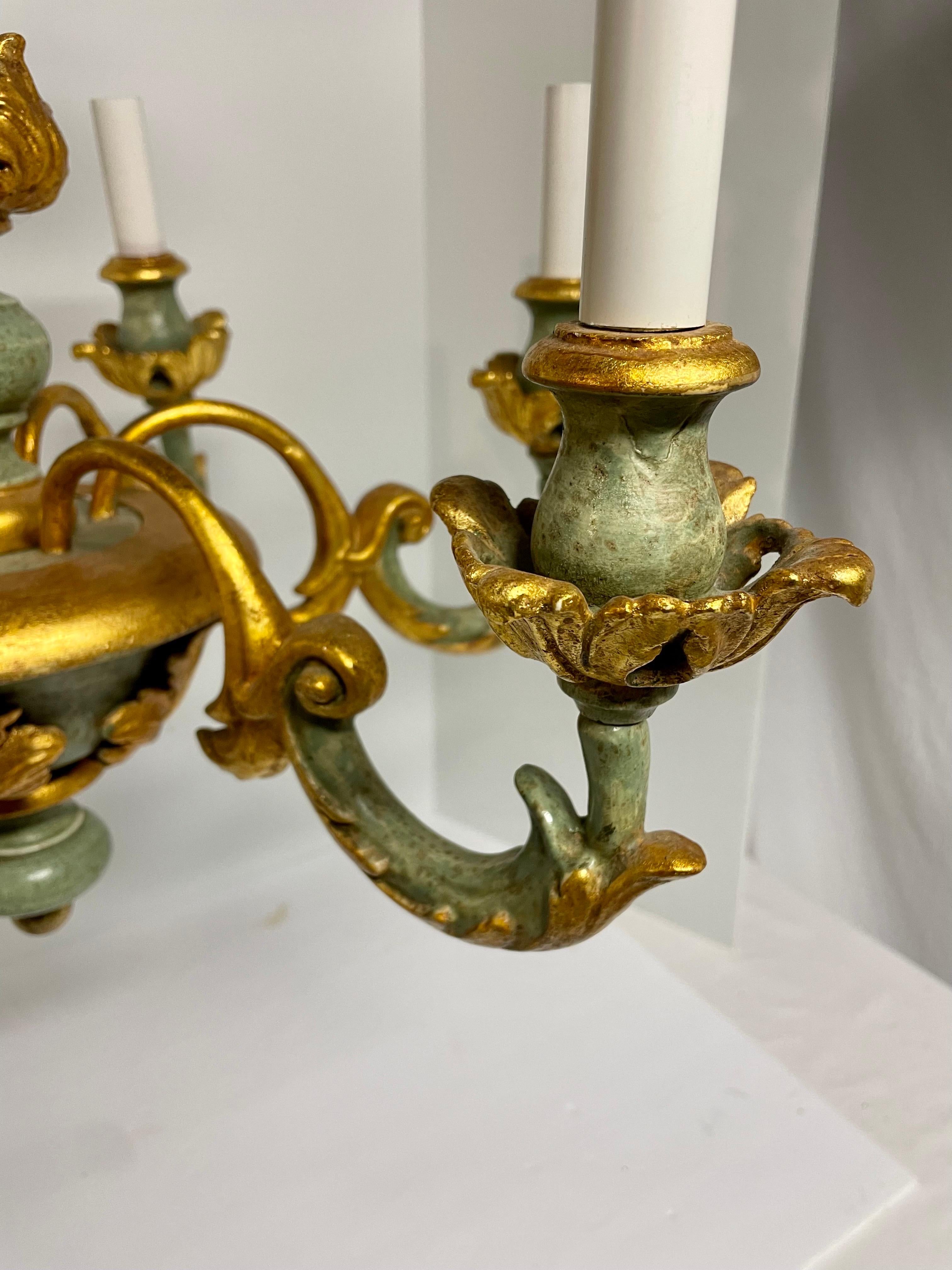 Great looking Italian giltwood and vintage green painted six arm chandelier. Good working condition. Wear is consistent to age and use, with slight gilt loss. 21