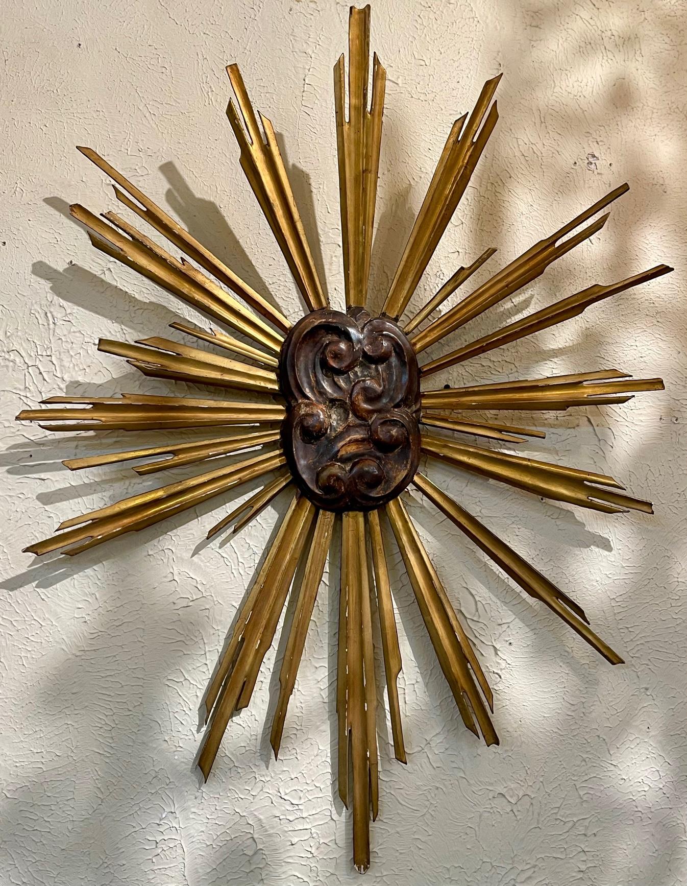 Antique Italian carved and giltwood sunburst element. Circa 1900. Perfect for today's transitional designs!