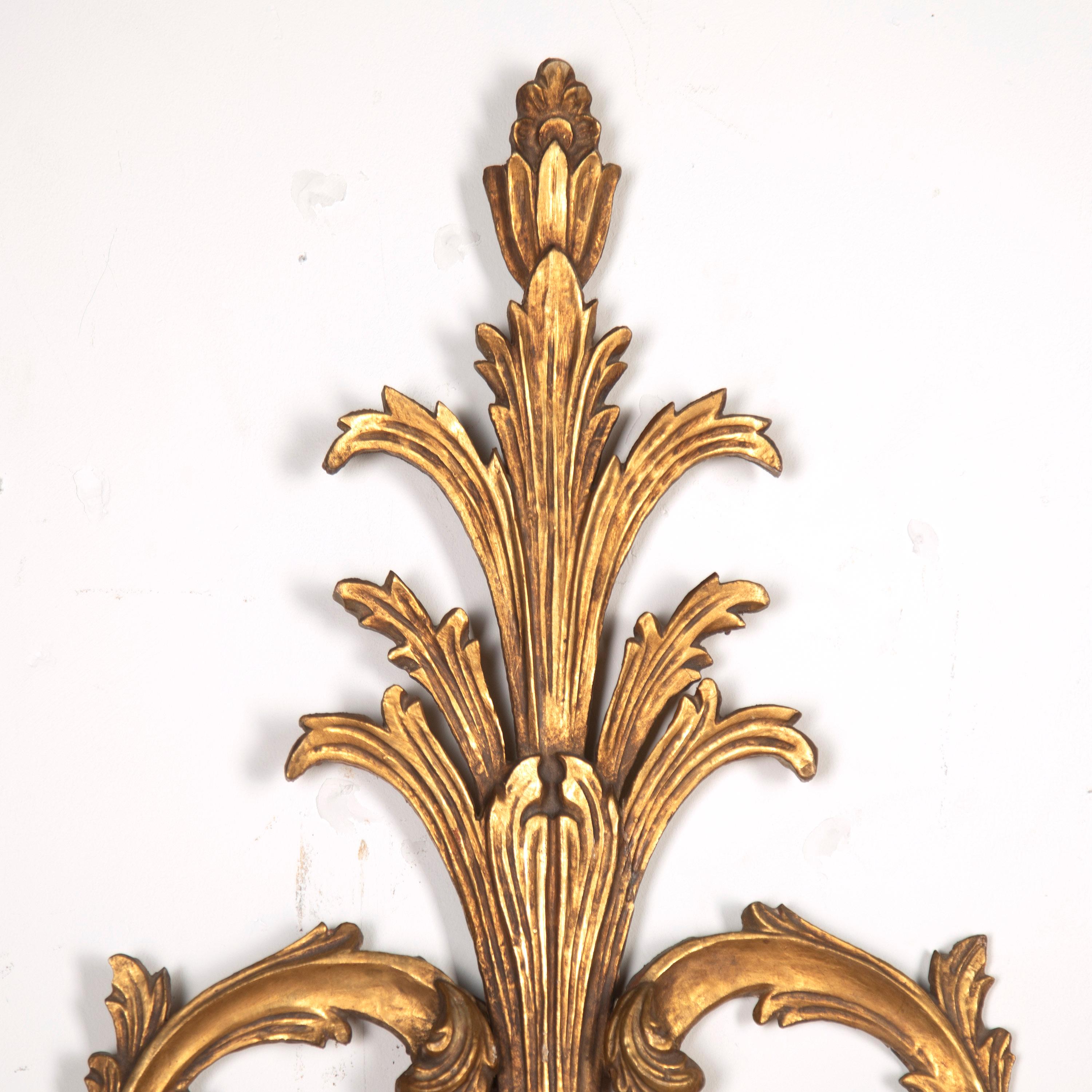 Fantastic pair of Italian giltwood wall lights. 

These lights are a superb example of Italian design and date to the mid to late 19th Century. 

Both are of great scale and are wonderfully formed, giving them a dramatic impact. These sconces