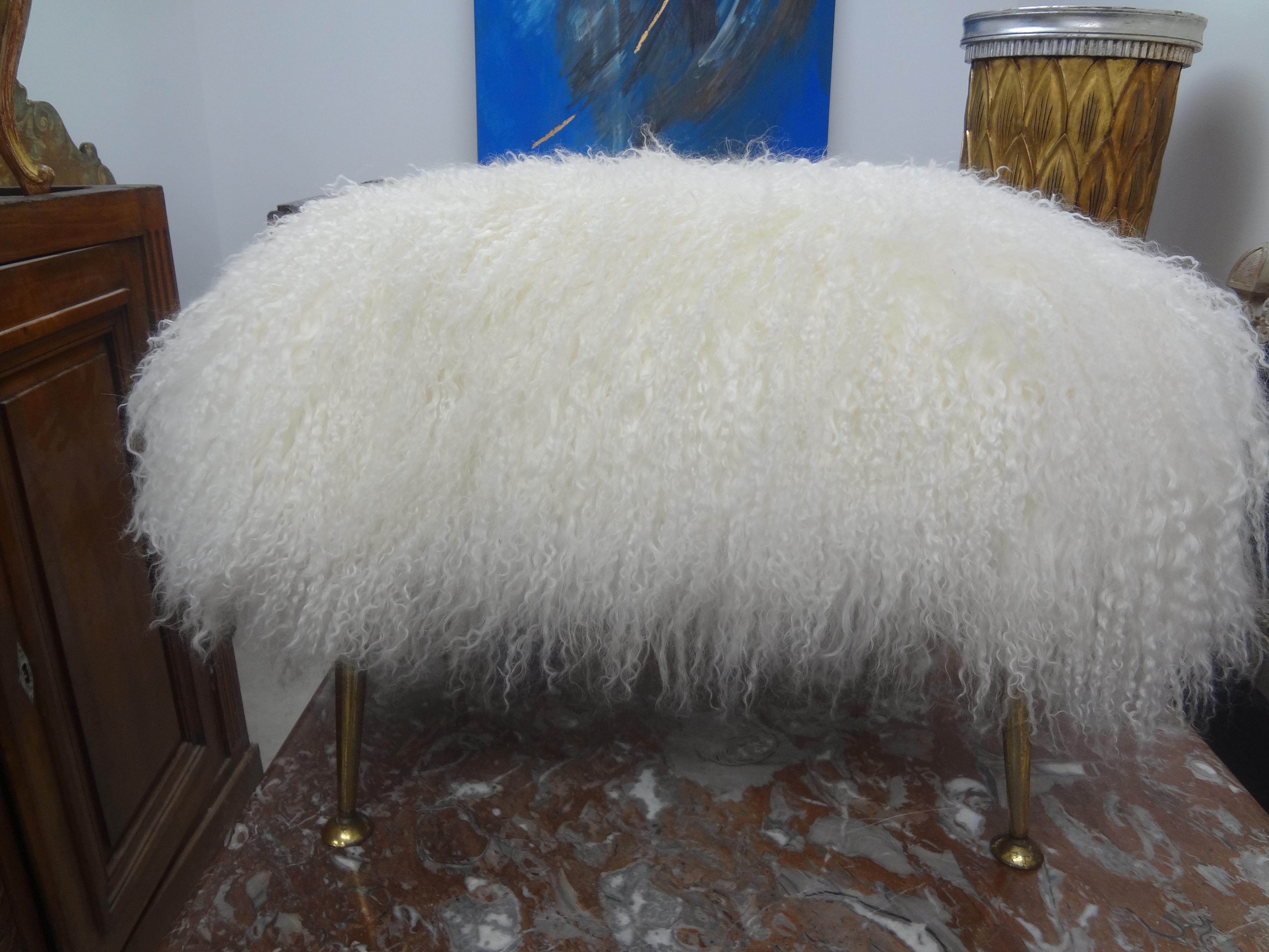 Italian Gio Ponti inspired ottoman, stool, poof or bench with splayed legs newly upholstered in white Mongolian lambs wool.