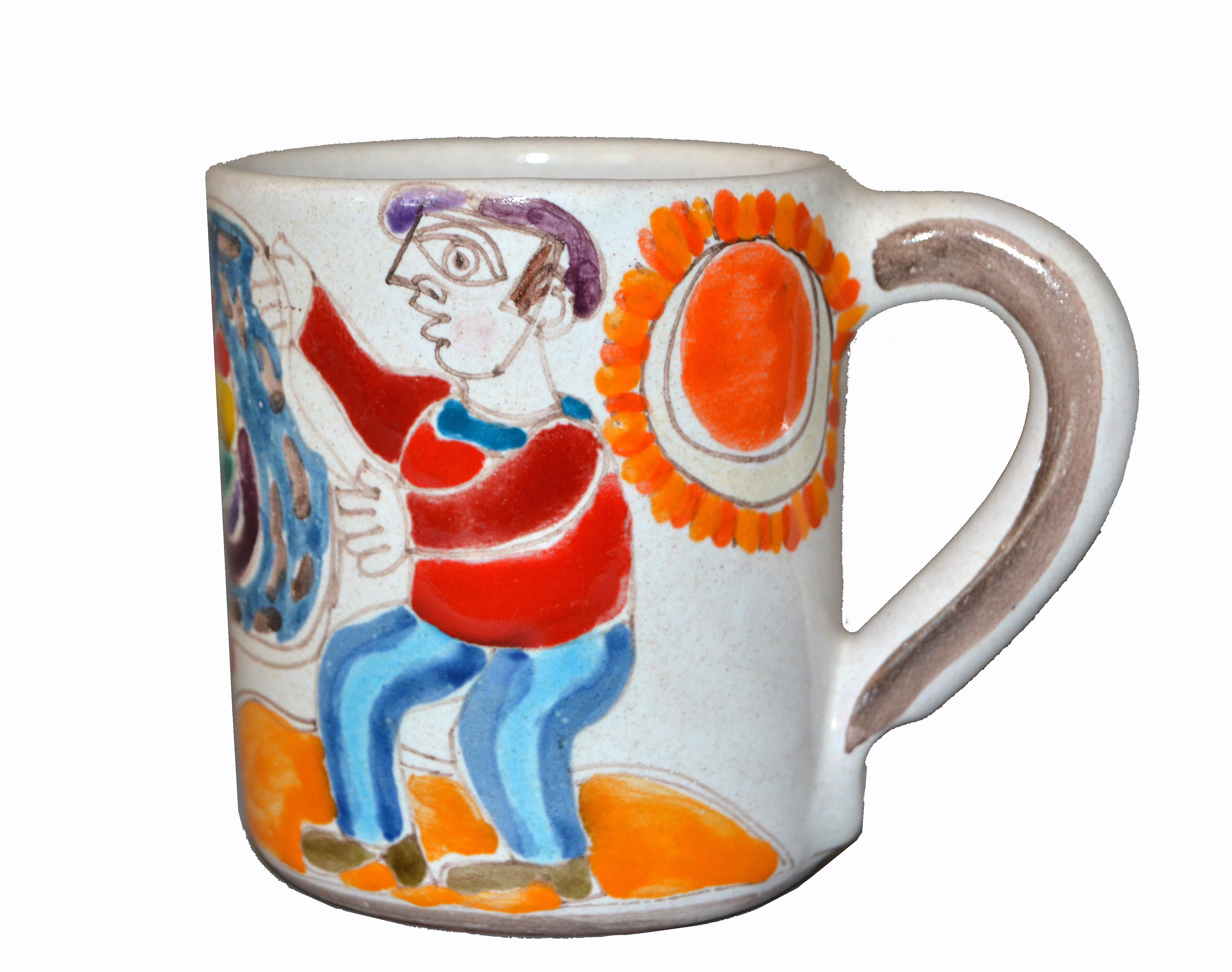 Original Italian Giovanni Desimone hand painted art pottery, decor mug or cup with a scene of a fisherman casting his net and caught two fish on a sunny day.
The mug is glazed and very colorful.
DeSimone Mark and numbered underneath, 'DeSimone,