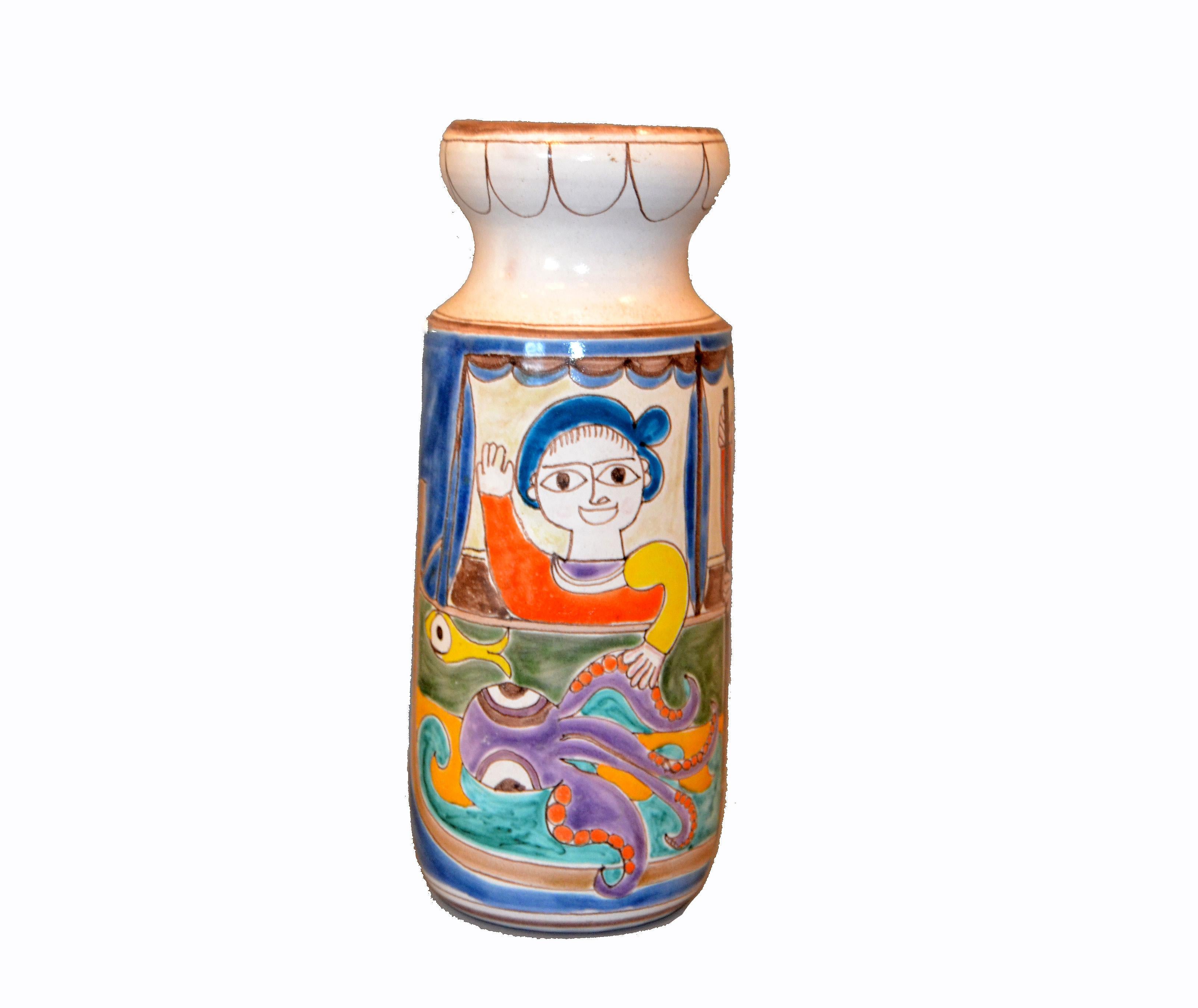 Original Italian Giovanni Desimone hand painted tall art pottery flower vase, vessel.
The glazed vase painting depicts two fishermen in action catching fish and octopus.
Marked and numbered on underside, 'Desimone, Italy / 13'.
THIS ITEM WILL BE