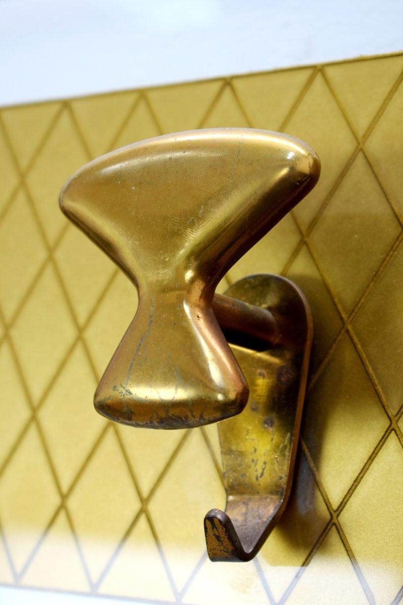 Italian Glass and Brass Coat Rack, 1950s.
Dimensions: H= 185 cm; W= 110 cm; D= 23 cm.
