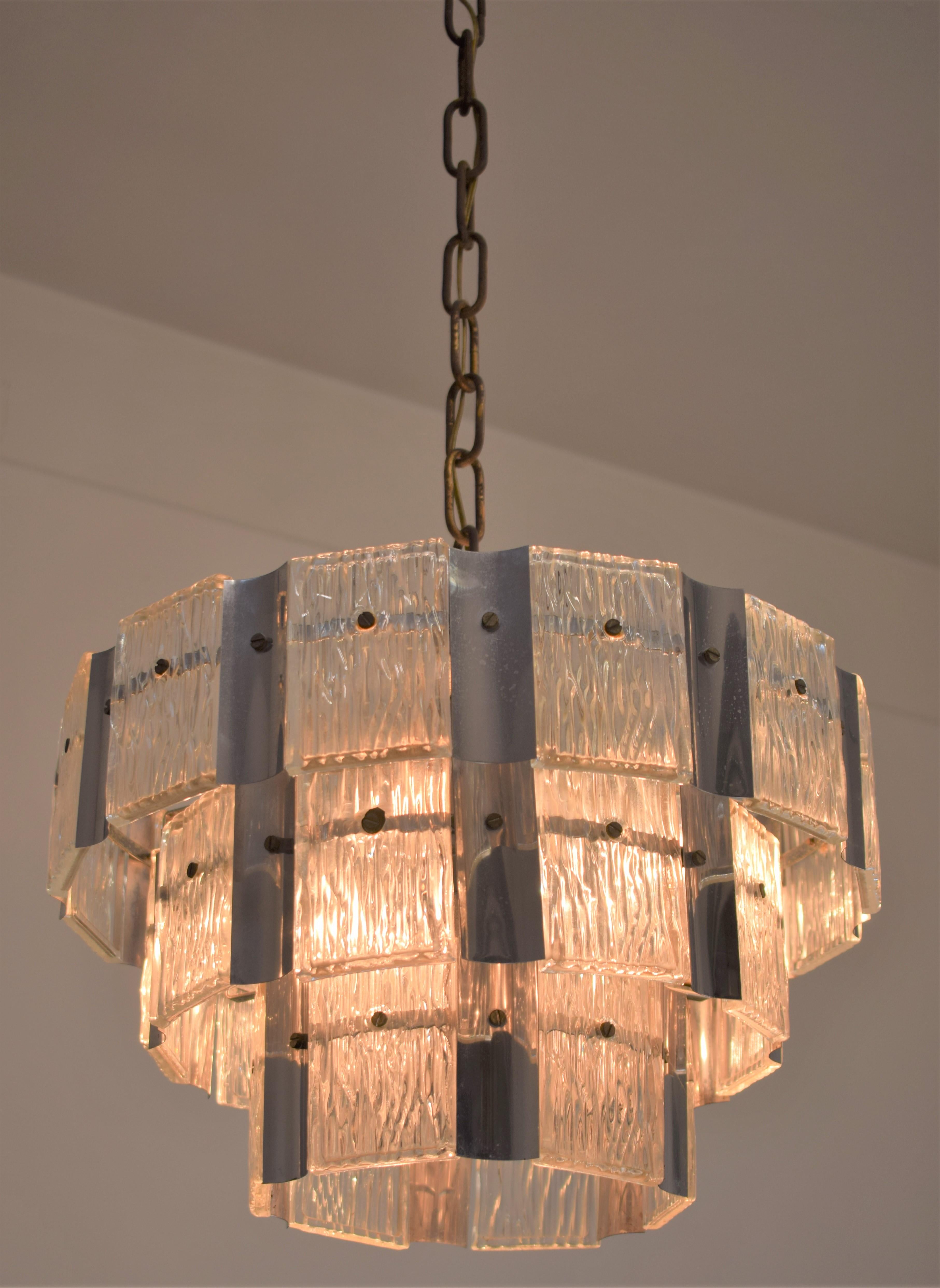 Italian glass and steel chandelier, 1970s.

Dimensions: H= 90 cm; D= 40 cm.