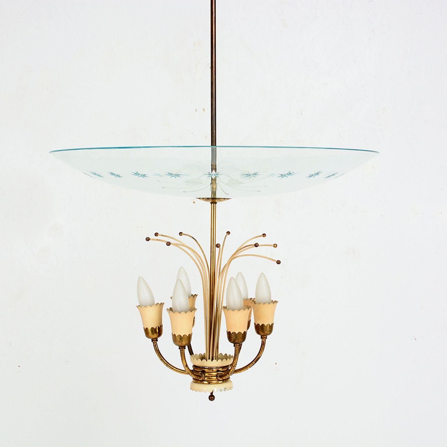 Delicate and graceful 6 arm Italian Chandelier from the 1950s Italy
Style attributed to Fontana Arte Max Ingrand 1955
Unmarked.
Airy Sculptural form.
Made with cut glass, patinated brass and painted aluminum.
H 48 in. x Diameter 23.
Original