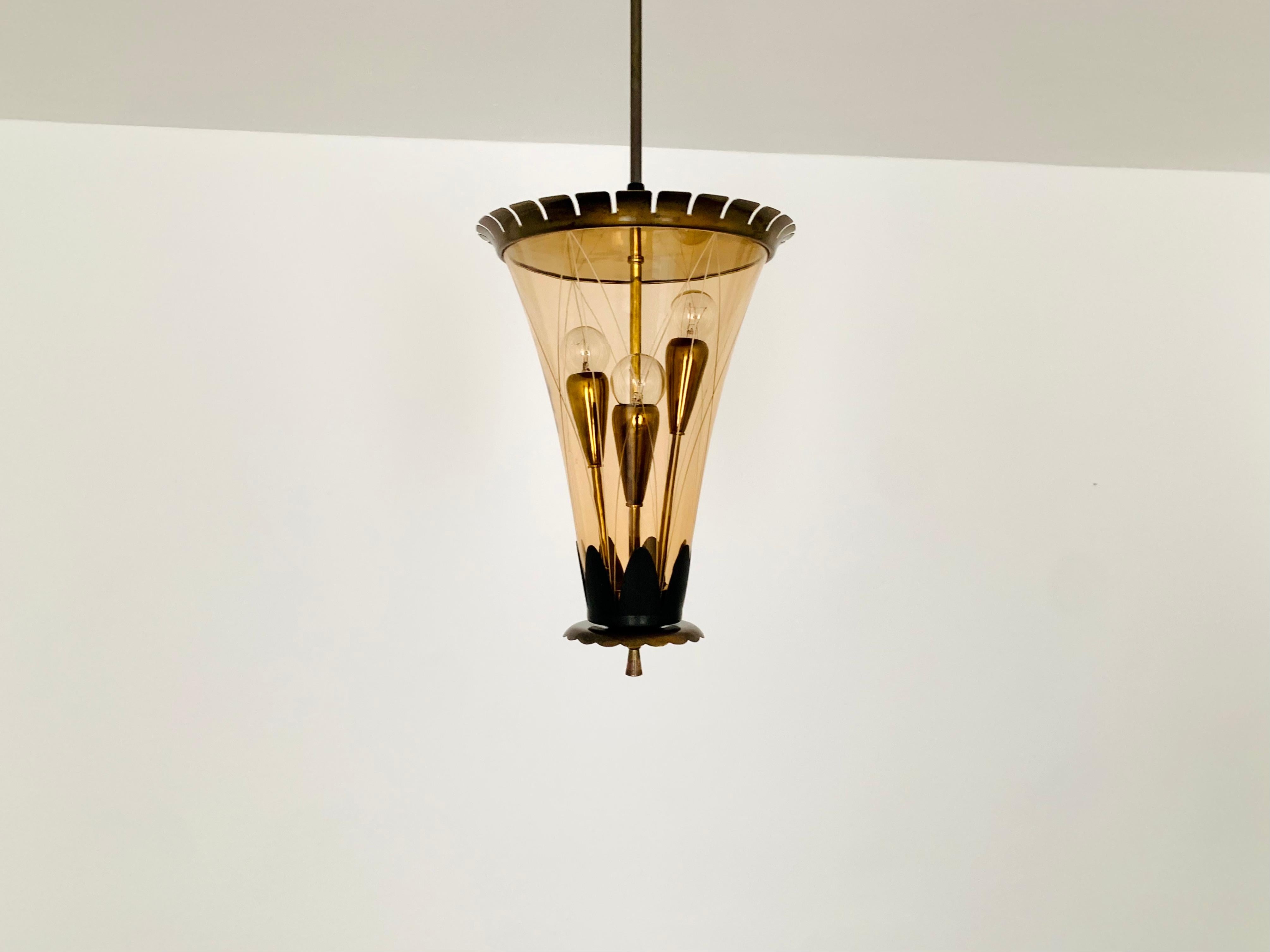 Exceptionally decorative Italian ceiling lamp from the 1950s.
Very detailed and high-quality processed.
Wonderful design and an asset to any home.
A wonderful play of light is created.

Condition:

Very good vintage condition with slight