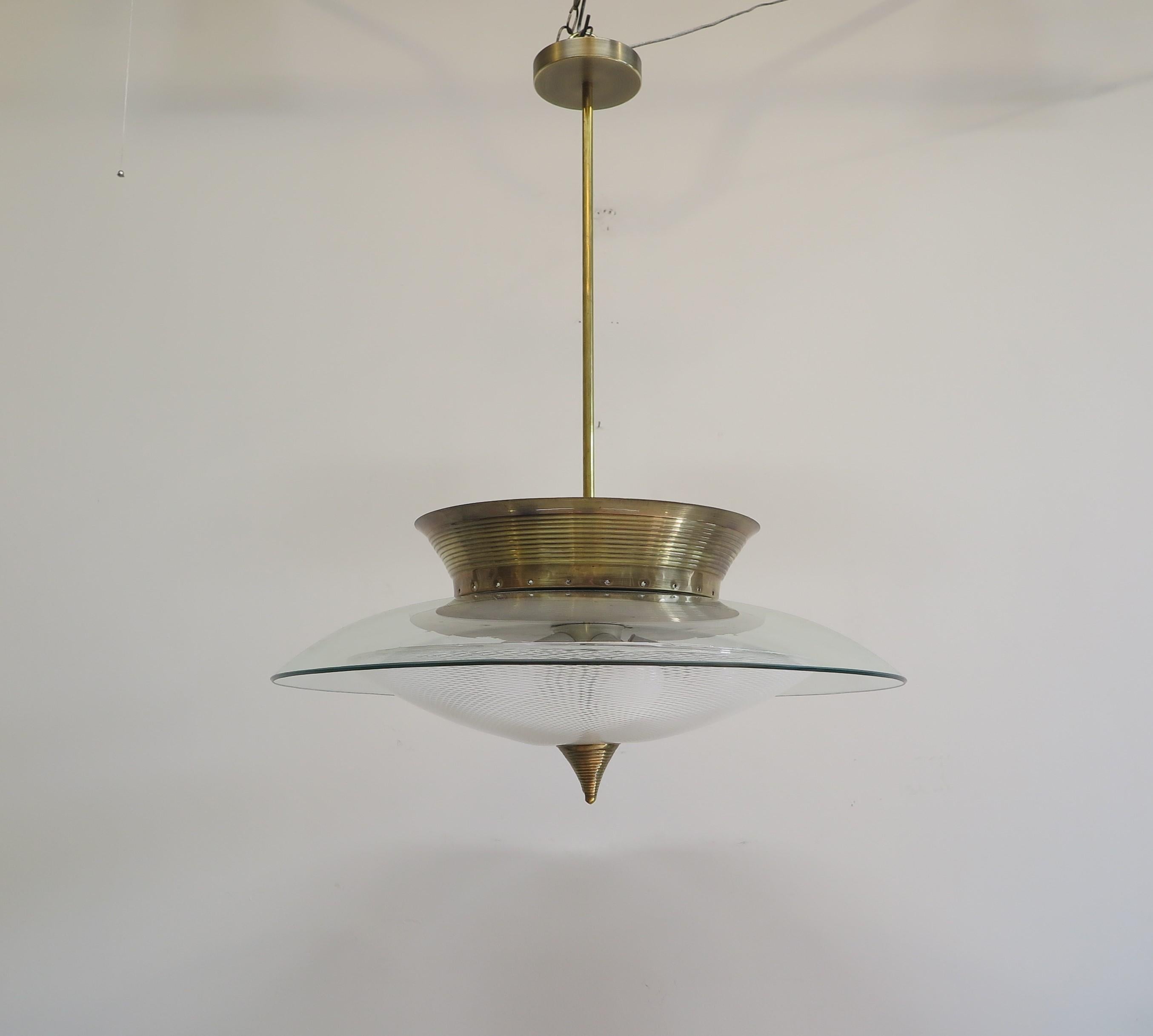 Italian Chandelier Pendant light attributed to Fontana Arte & Pietro Chiesa. Spectacular Pendant style chandelier having both upward and downward light. Sockets have been updated (the original sockets are available if desired). Solid brass spun