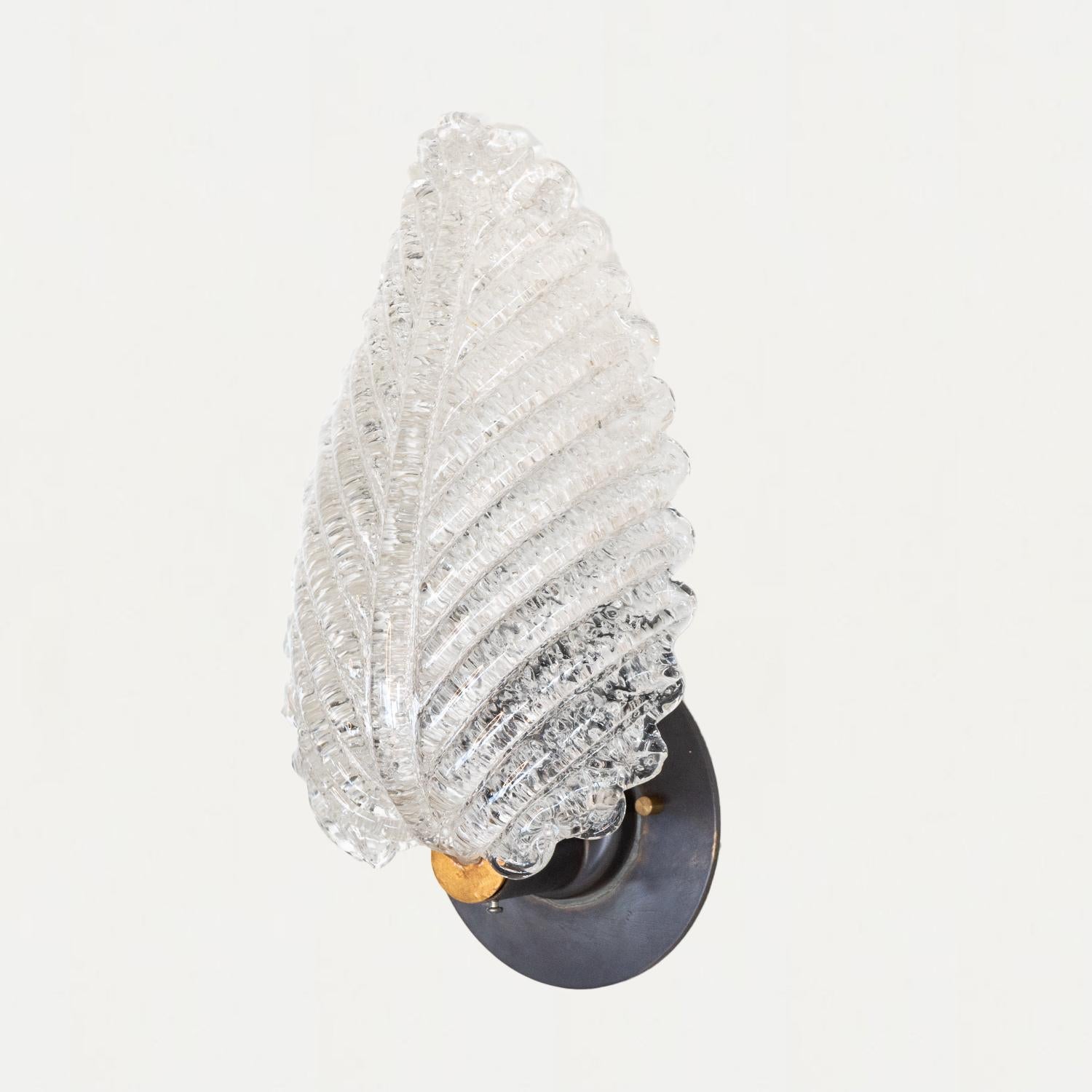 Beautiful blown glass sconce from Italy, 1950s. Large clear etched glass in the shape of a leaf with brass hardware. Newly re-wired with single socket and new 4.5