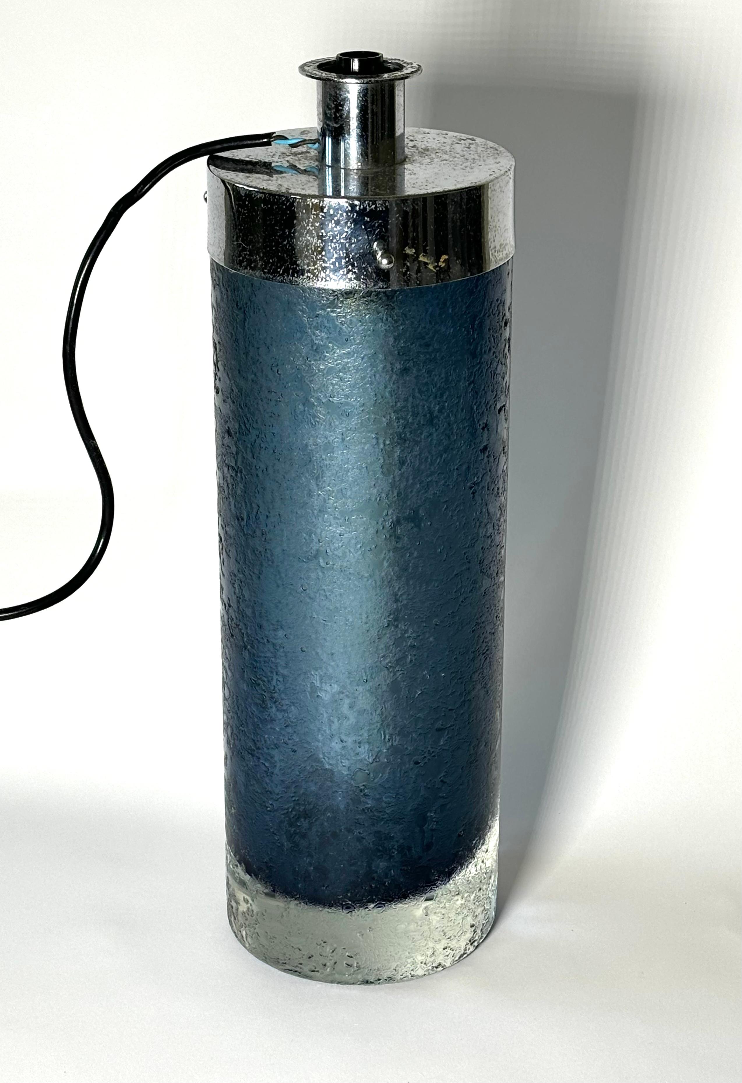 Glass table lamp designed by Flavio Poli and produced by Seguso, 1950s.

Biography
Designer, businessman, ceramic artist. Born in Chioggia, he attended the Istituto d'Arte di Venezia and began work as a designer in ceramics. in 1929 he switched to