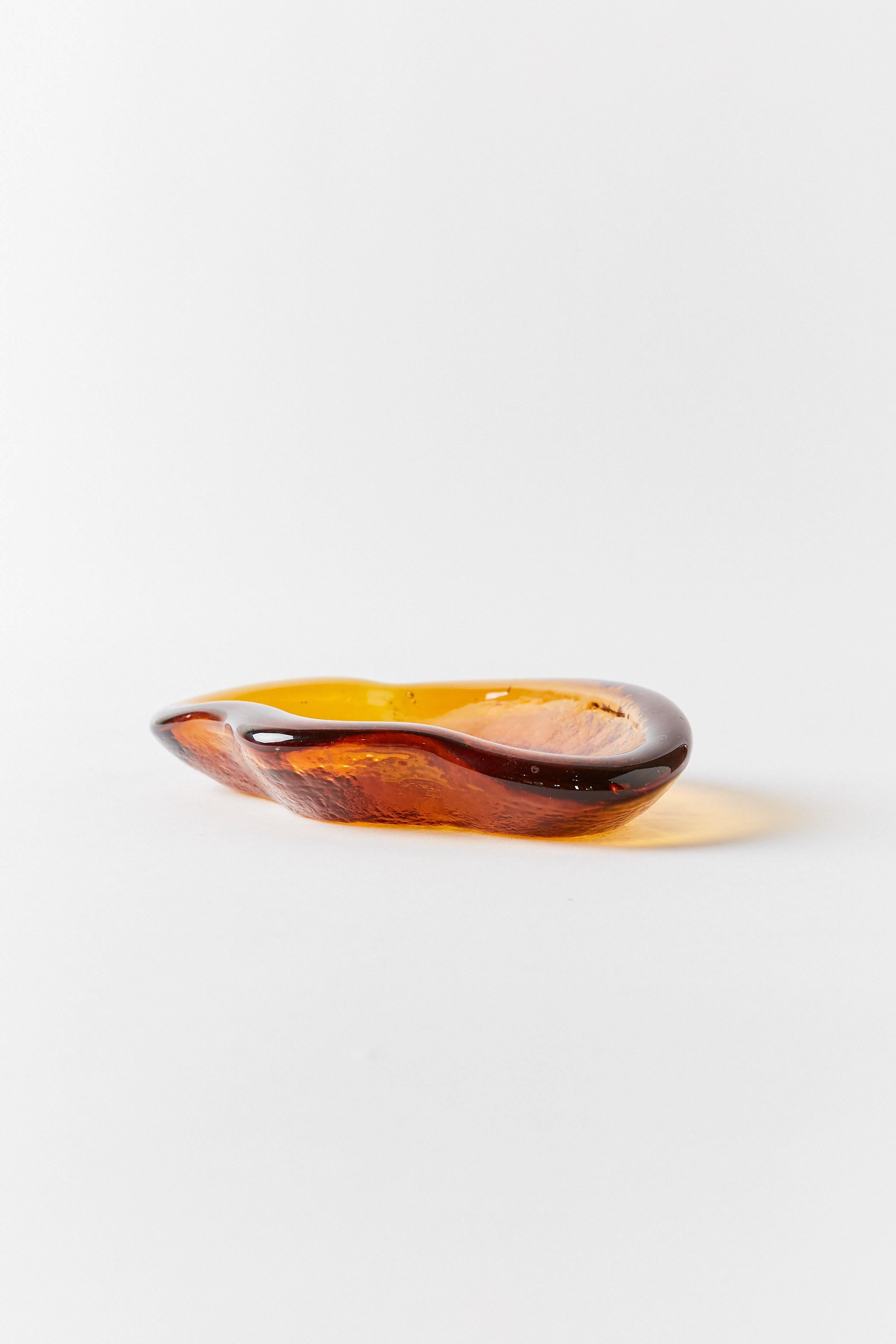 Italian glass organic shape shallow bowl in beautiful burnt orange color.