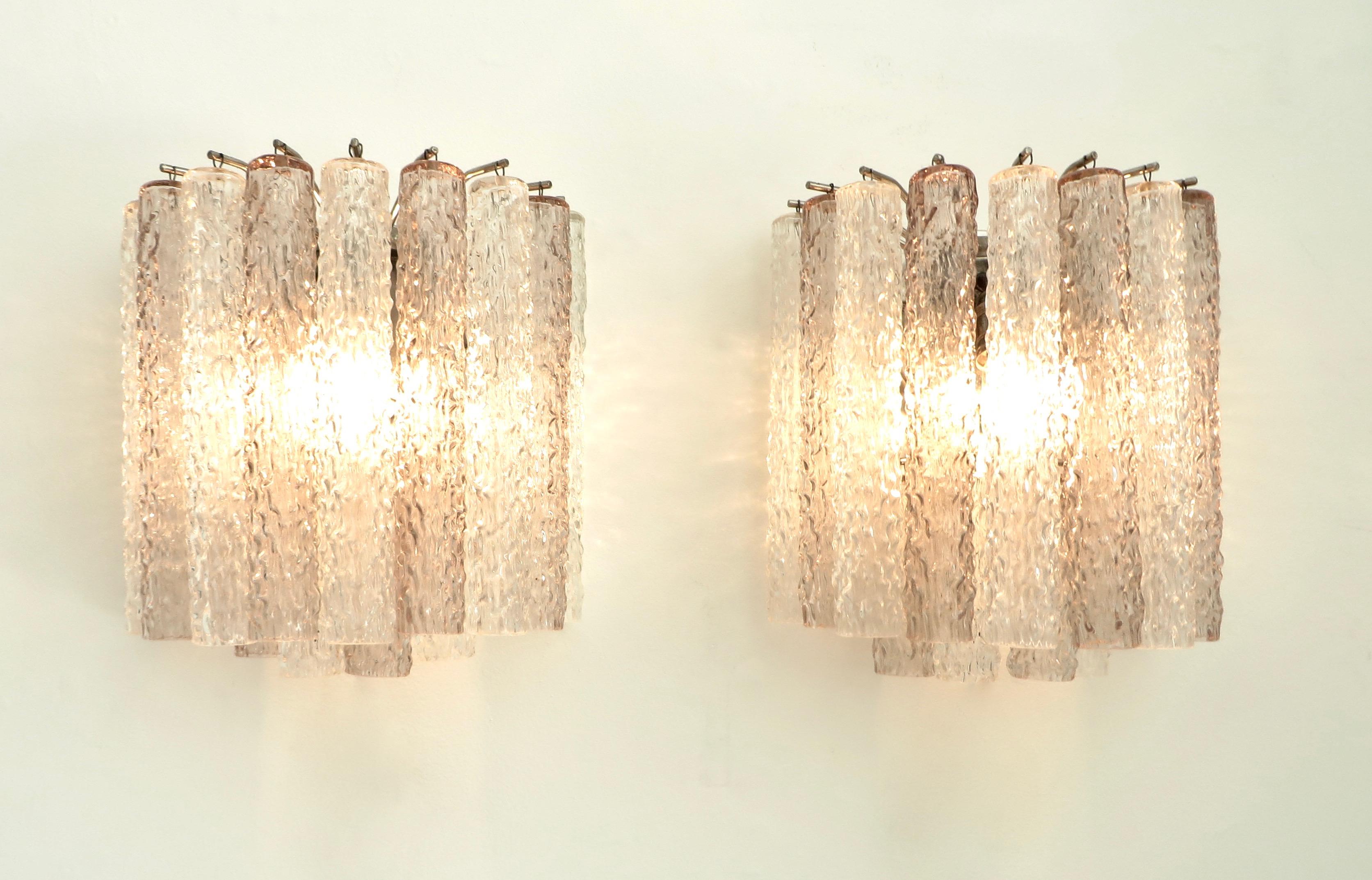 Signed Pair of Venini, made in Italy Murano Tronchi sconces. Pale lavender pink and clear Tronchi Murano glass.
Perfect for a bedroom, powder room or foyer.
Each sconce takes three candelabra bulbs.
Overall size: 11.5