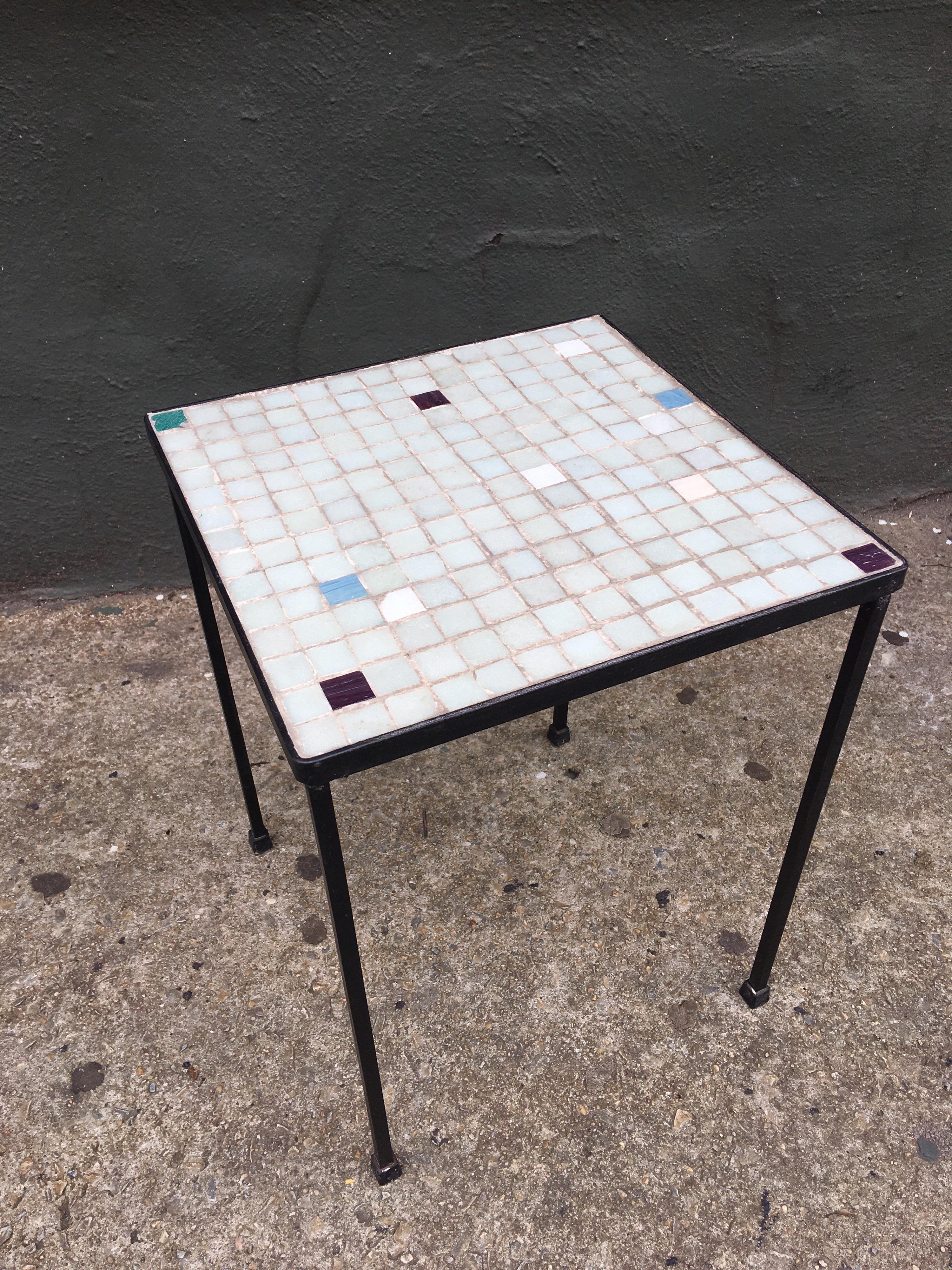 Single wrought iron table with Italian glass tiles. I've seen these attributed to being imported by Raymor. Perfect little table for drinks or morning coffee!