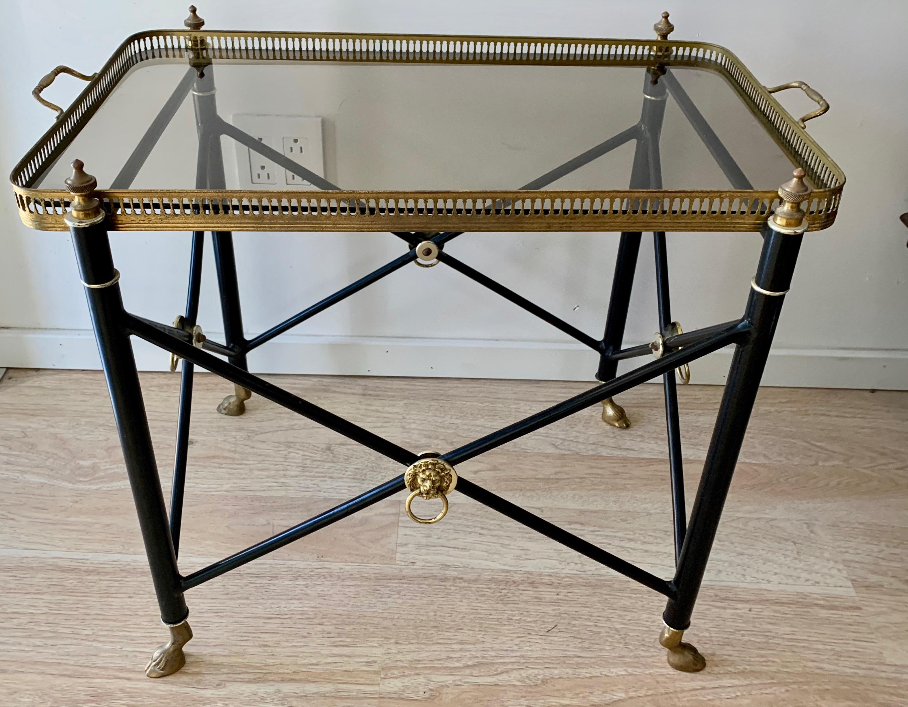 French tray table with smoked glass tray and lion detailing, with brass hoof feet - a wonderful table with removable tray - a handsome cocktail, side or serving / TV table.

Very functional and stylish for any room, from bedroom to fine living room