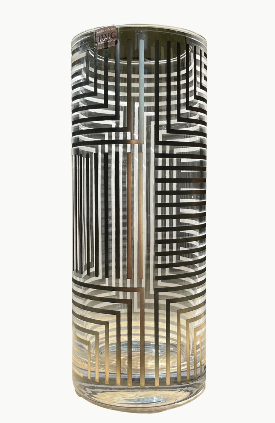 Transparent glass, silkscreen printed silver, natural patina. 
Brazilian multi award winning designer Flavia Alves de Souza (b. 1969) designed for Egizia, during her collaboration with Sottsass Associati in Milan from 1995-2001.

Produced by Egizia,
