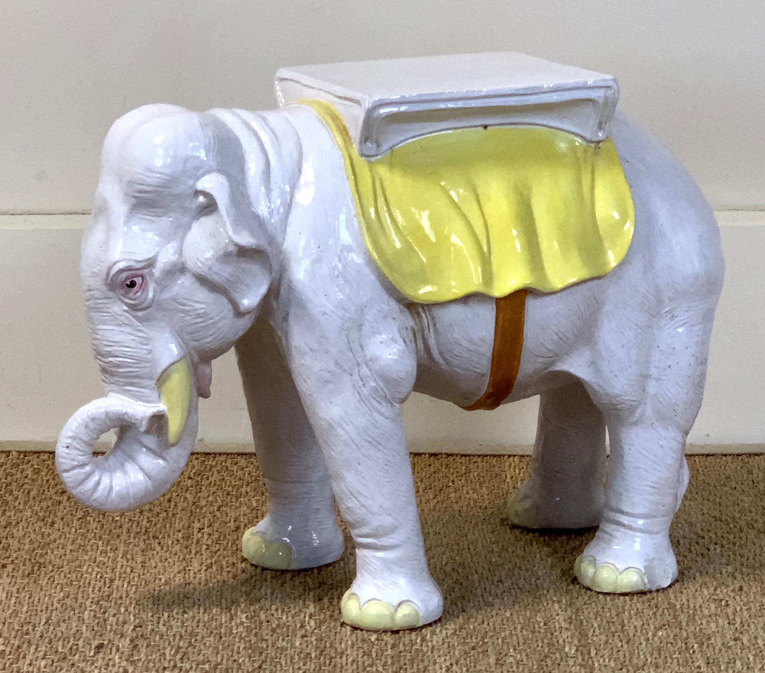 A very charming and beautifully rendered mid-20th century. Italian paint decorated glazed ceramic elephant garden seat.