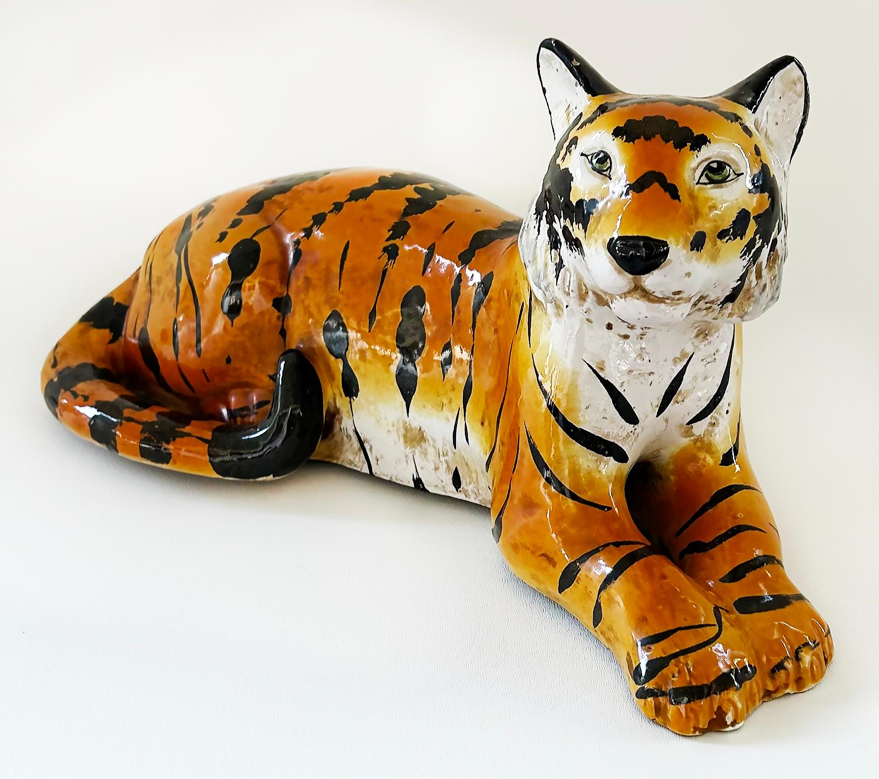 Italian Glazed Ceramic Sculpture of a Tiger in Repose, Circa 1960s

Offered for sale is an Italian glazed ceramic sculpture of a tiger in repose dating from the mid-late 20th century.  The tiger is beautifully hand-painted and glazed in striking