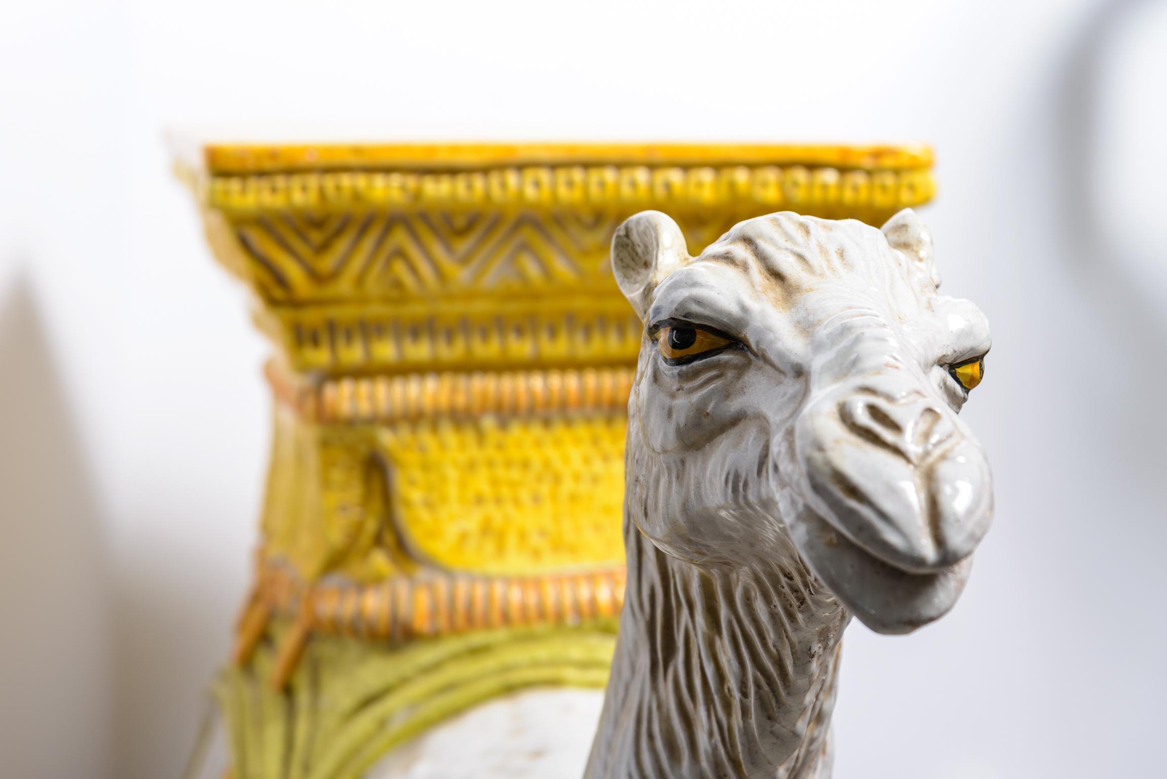 Just in this  very large and dramatic Italian Glazed Terra Cotta Camel Garden Seat/Stool
This beauty can be outdoors or indoors.
This camel is in very good condition no chips or repairs, consistent with age and use.