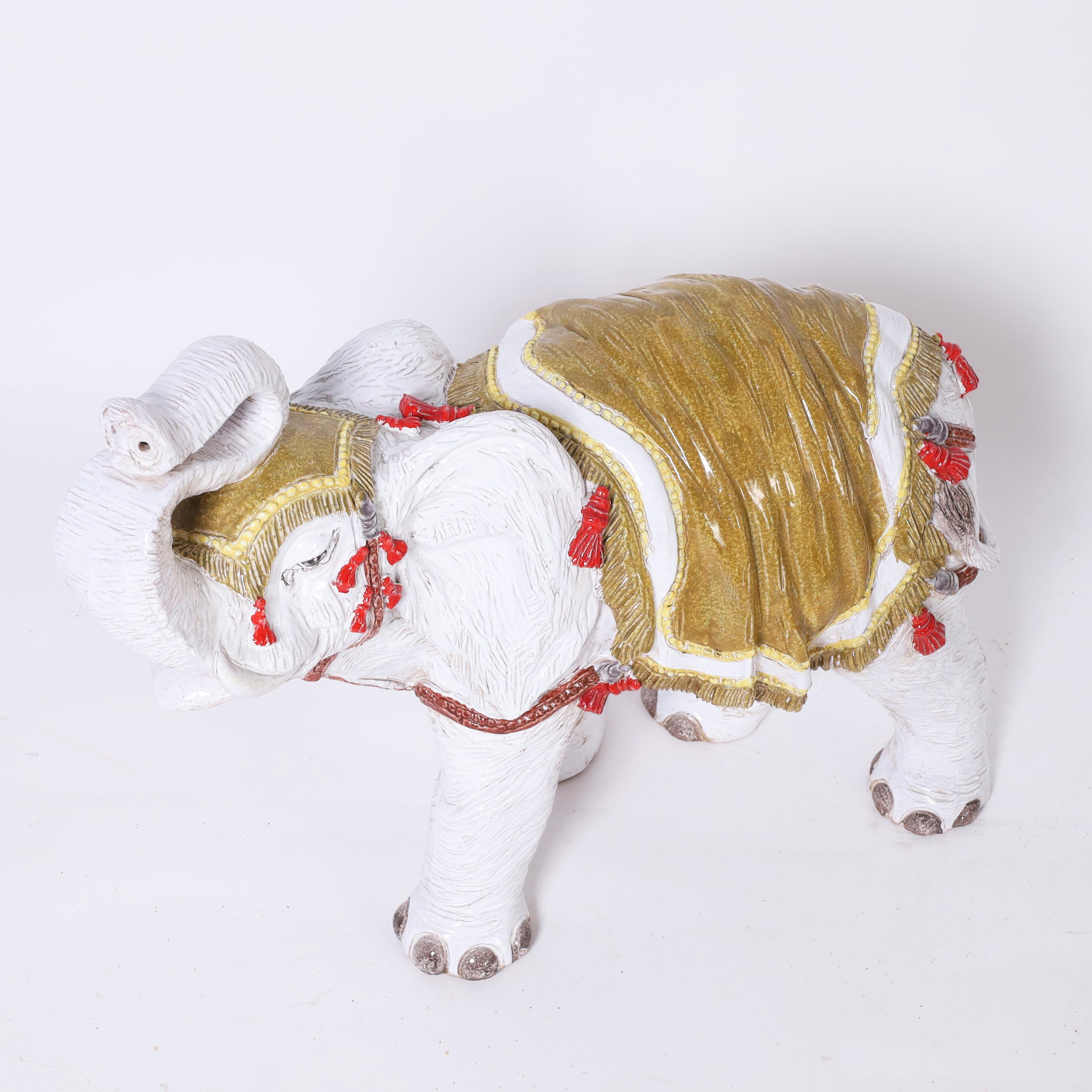Standout mid century Italian elephant sculpture crafted in terracotta, hand decorated and glazed. Trunk up for good luck.