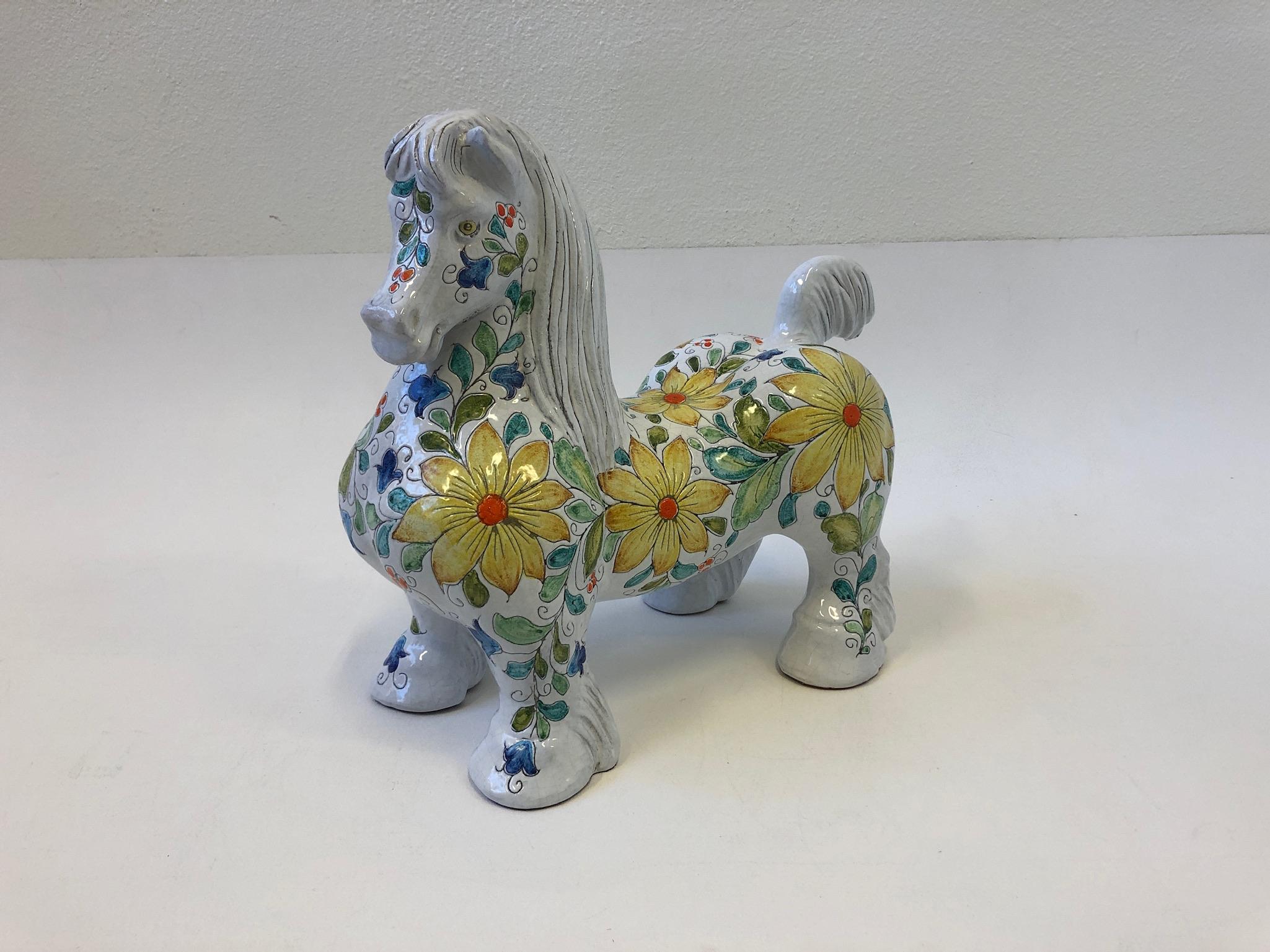 A beautiful 1970s Italian glazed terracotta horse sculpture by Mancioli for Raymor. The horse is hand painted with flowers all around and it’s marked made in Italy.
Overall dimensions: 18” wide, 7” deep, 16” high.