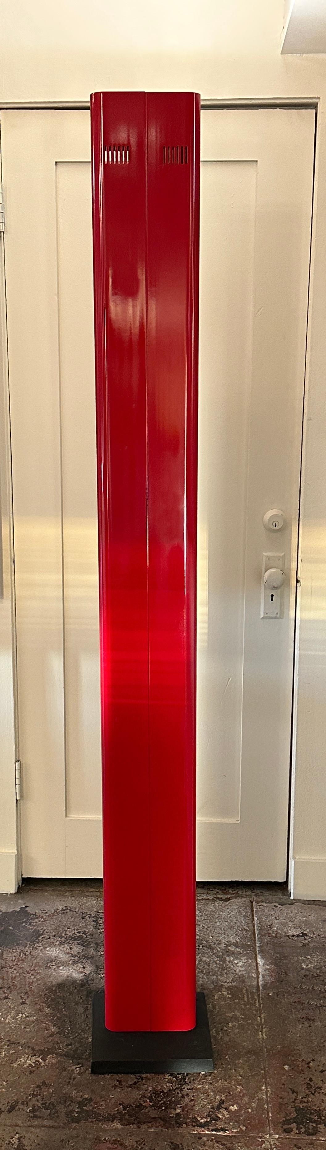 The elegant glossy red up-lighter is made of glossy red painted aluminum and rests on a cast iron base.
It projects a strong light on the ceiling and radiates with its timeless outer appearance. We have its black matching version available as well