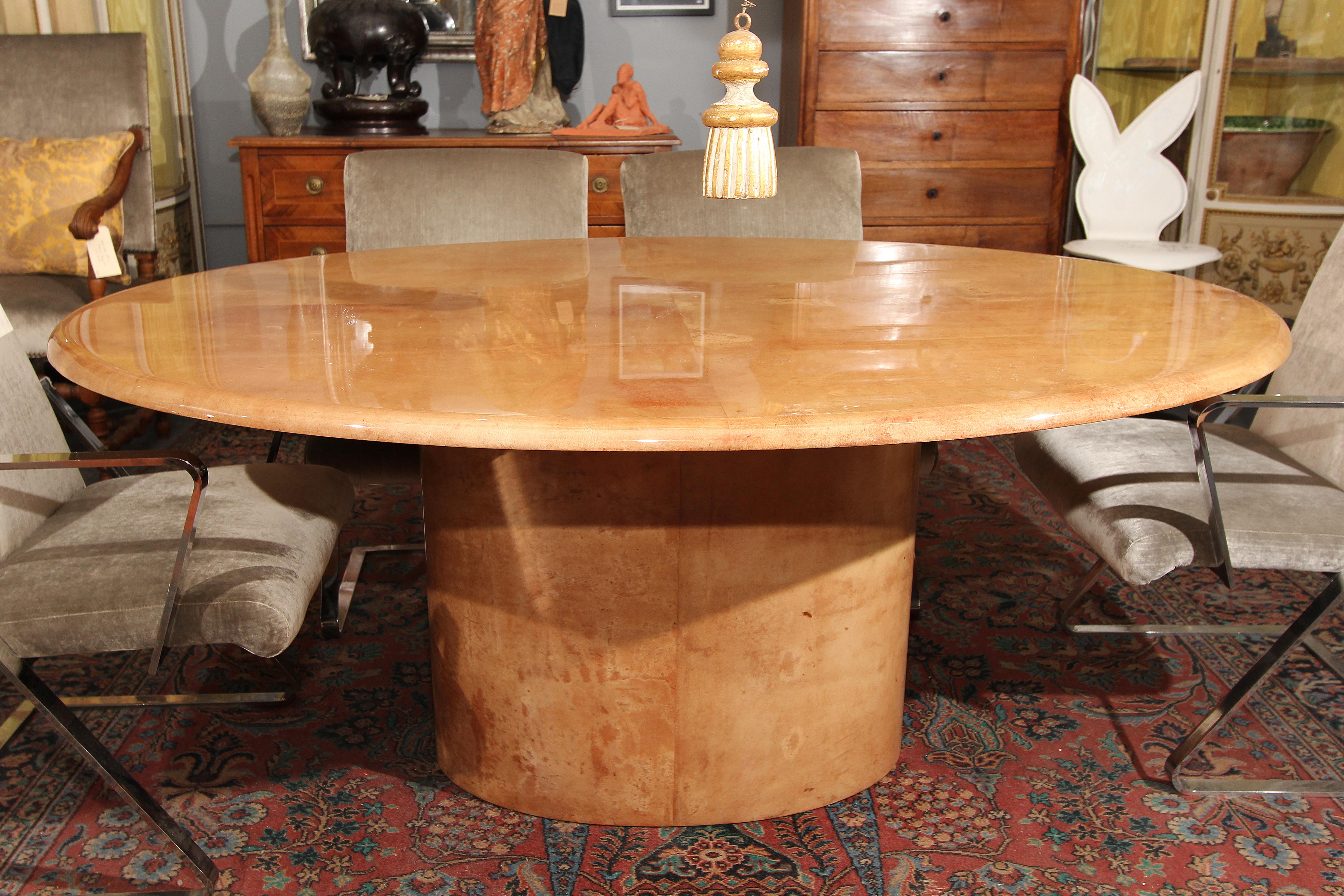 Italian lacquered goatskin oval dining table with oval pedestal base. Beautiful color and condition. Perfect desk or entry table.